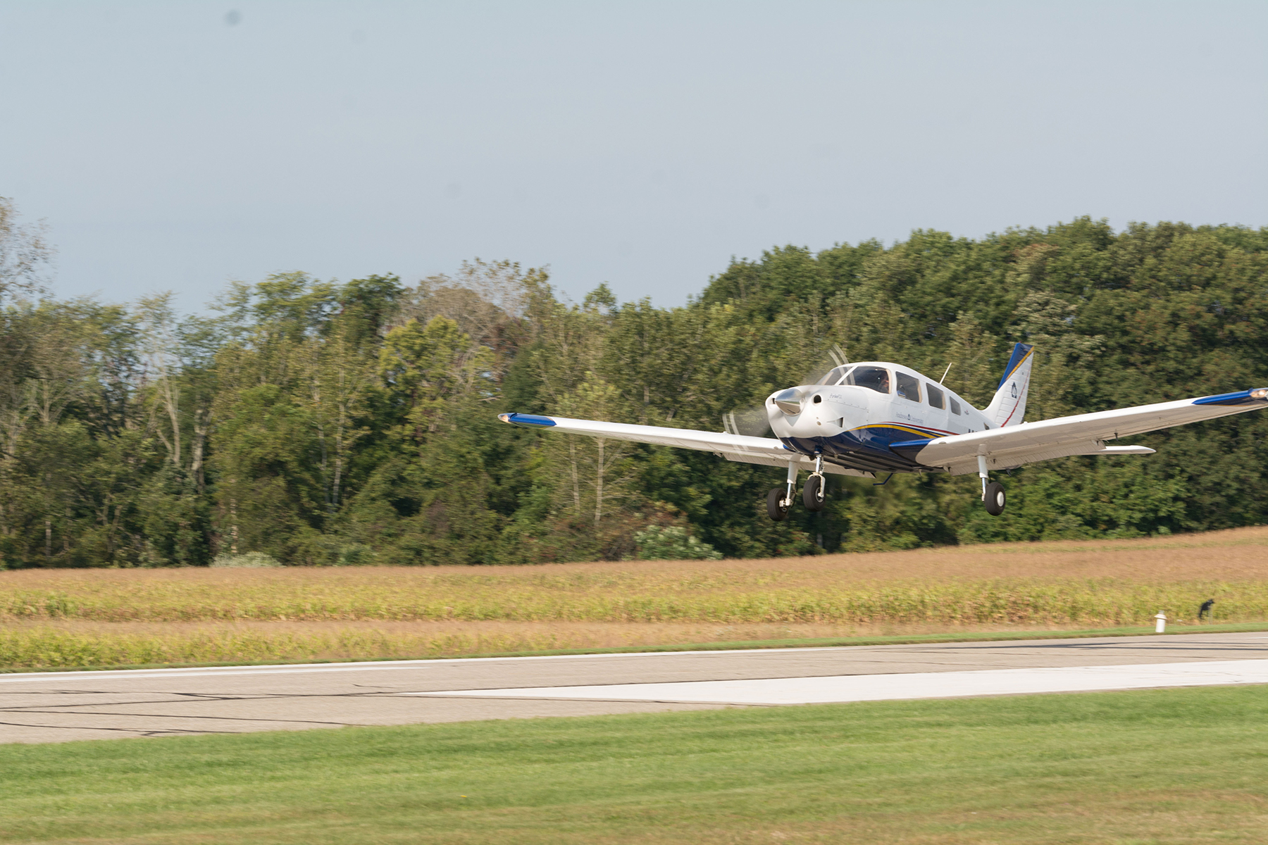 A plane lands at the Andrews University Airpark. 