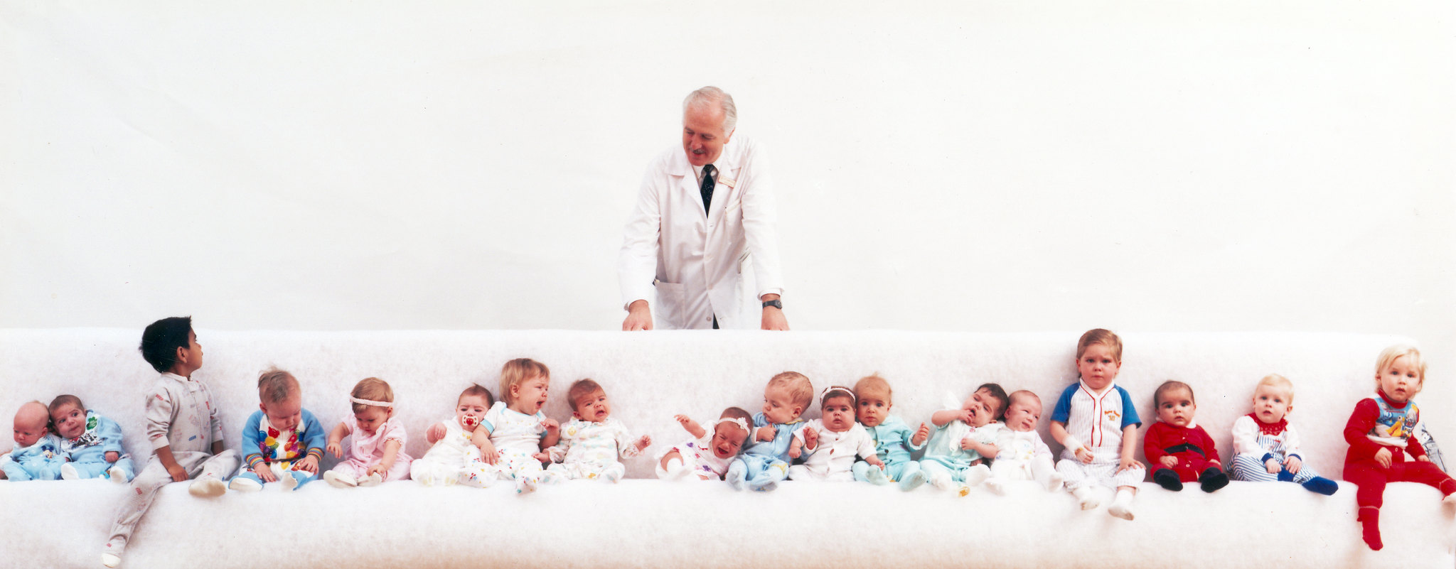 Leonard Bailey, MD, with some of the children who have benefited from his life-saving heart-transplant surgery. This photo was taken in March of 1989.