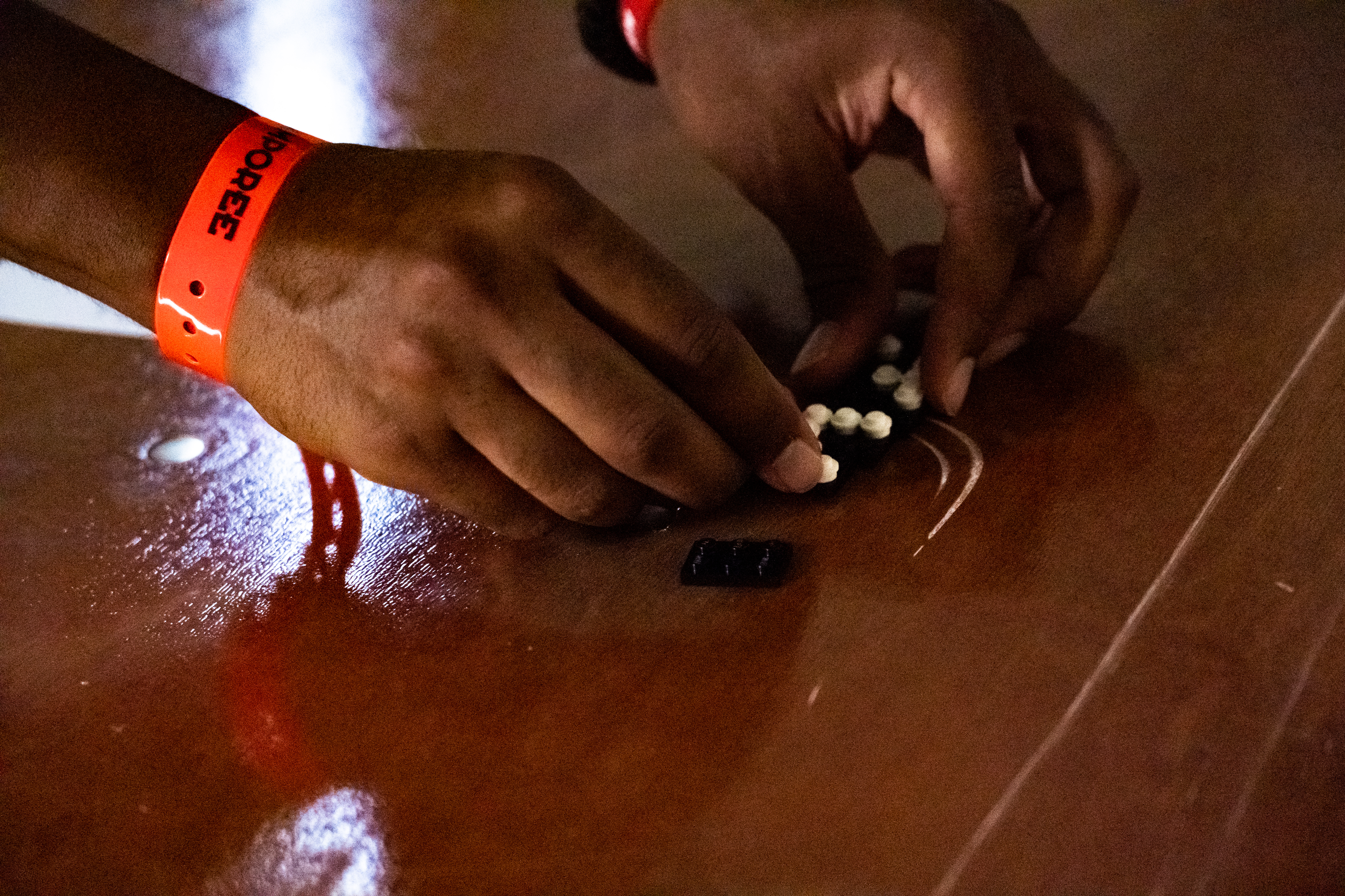 An attendee of the Braille Honor class assembles Legos to spell his name in braille.