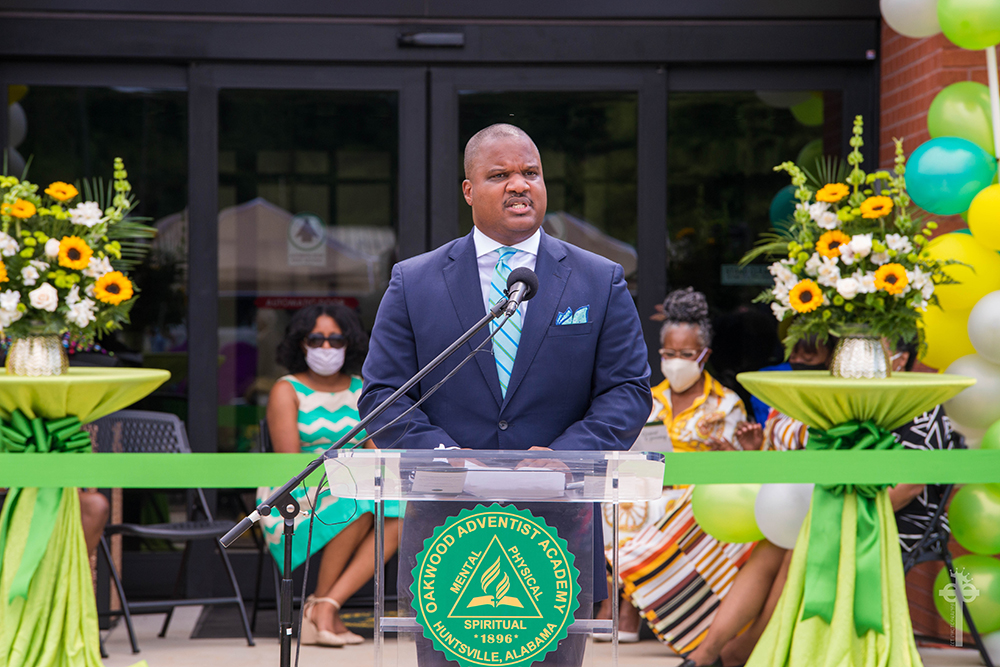 On August 9 Carlton Byrd addresses a group celebrating the Oakwood Adventist Academy bolding project opening