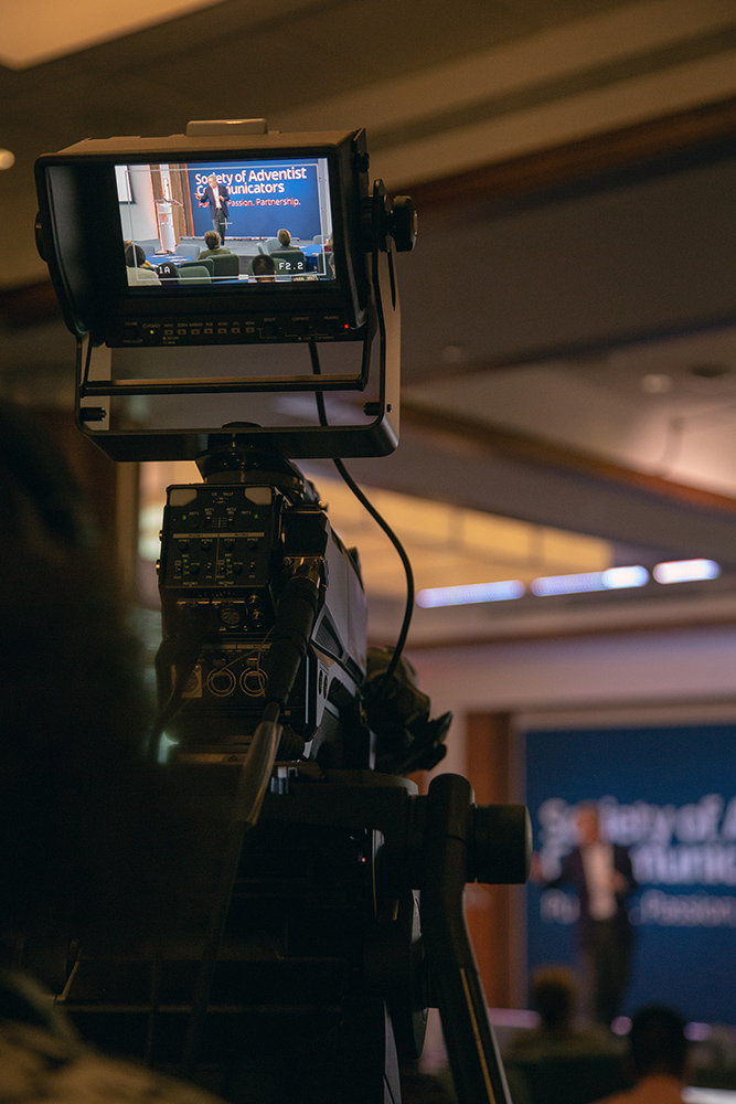 Camera operator focuses on a workshop presenter during the 29th annual SAC convention. 