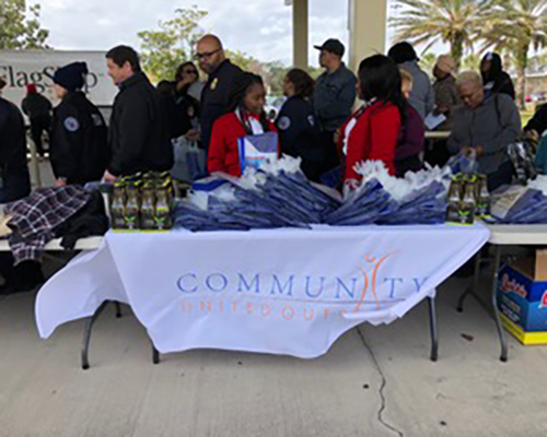 Airport employees form a line to receive free food at the Orlando International Airport.