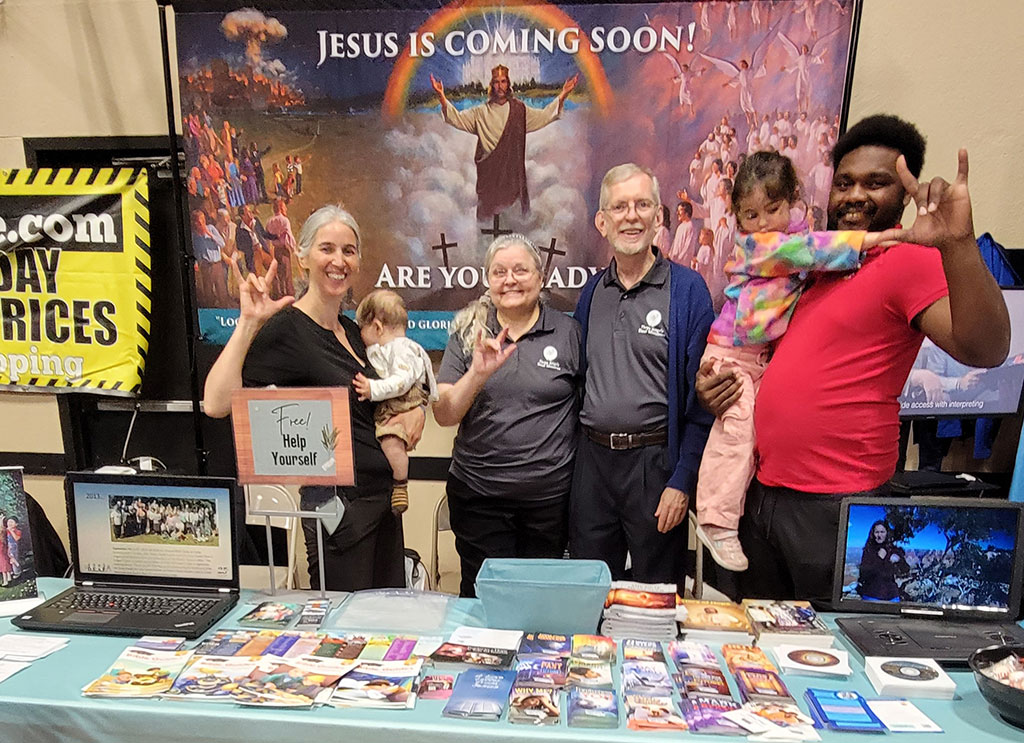 Jessica McGowan Smith (left), Southern New England Conference Deaf Everywhere Are Family (DEAF) Ministry Coordinator, and SNEC member Jonathan Salomon (right) join Three Angels Deaf Ministries at the Connecticut Deaf Expo in Waterbury, CT, to share Jesus with the Deaf community.