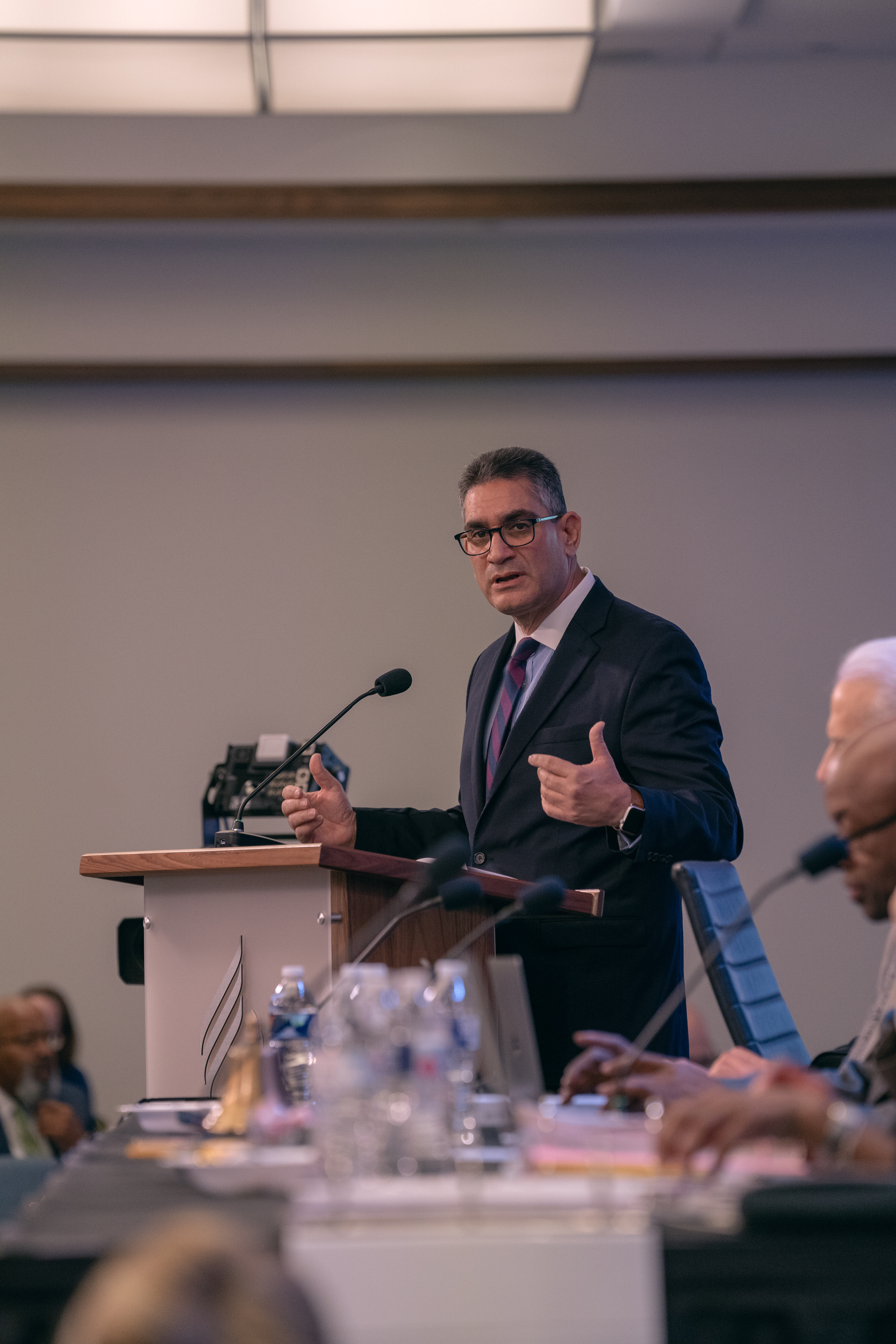 Raymond Jimenez, III, plan administrator of Adventist Retirement shares financial concerns about the retirement health-care assistance program with YEM delegates.