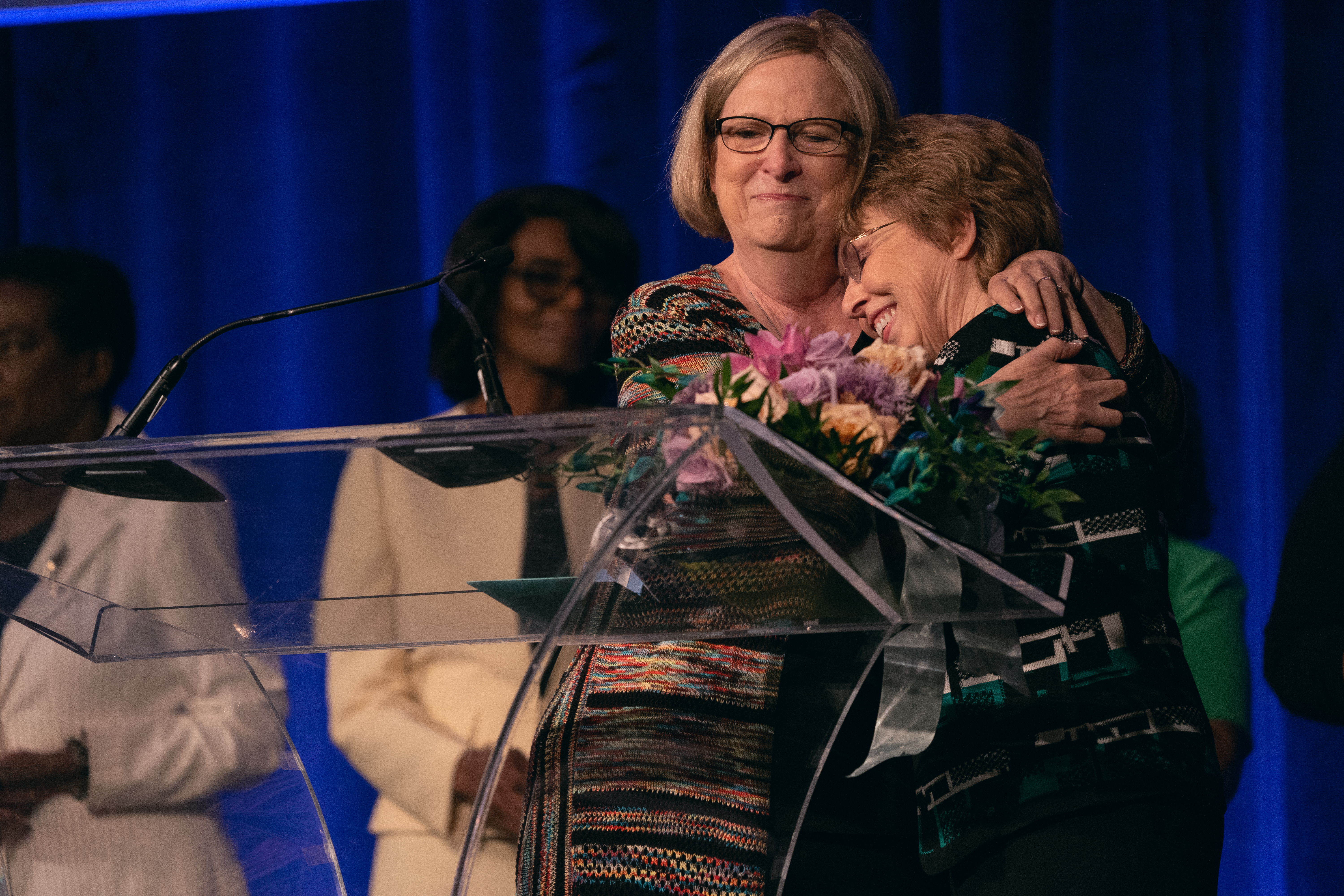 Nancy Buxton, director of Women’s Ministries for the Mid-America Union, embraces Carla Baker, director of Women’s Ministries for the North American Division, during the surprise farewell ceremony. Baker has served NAD for 14 years. 