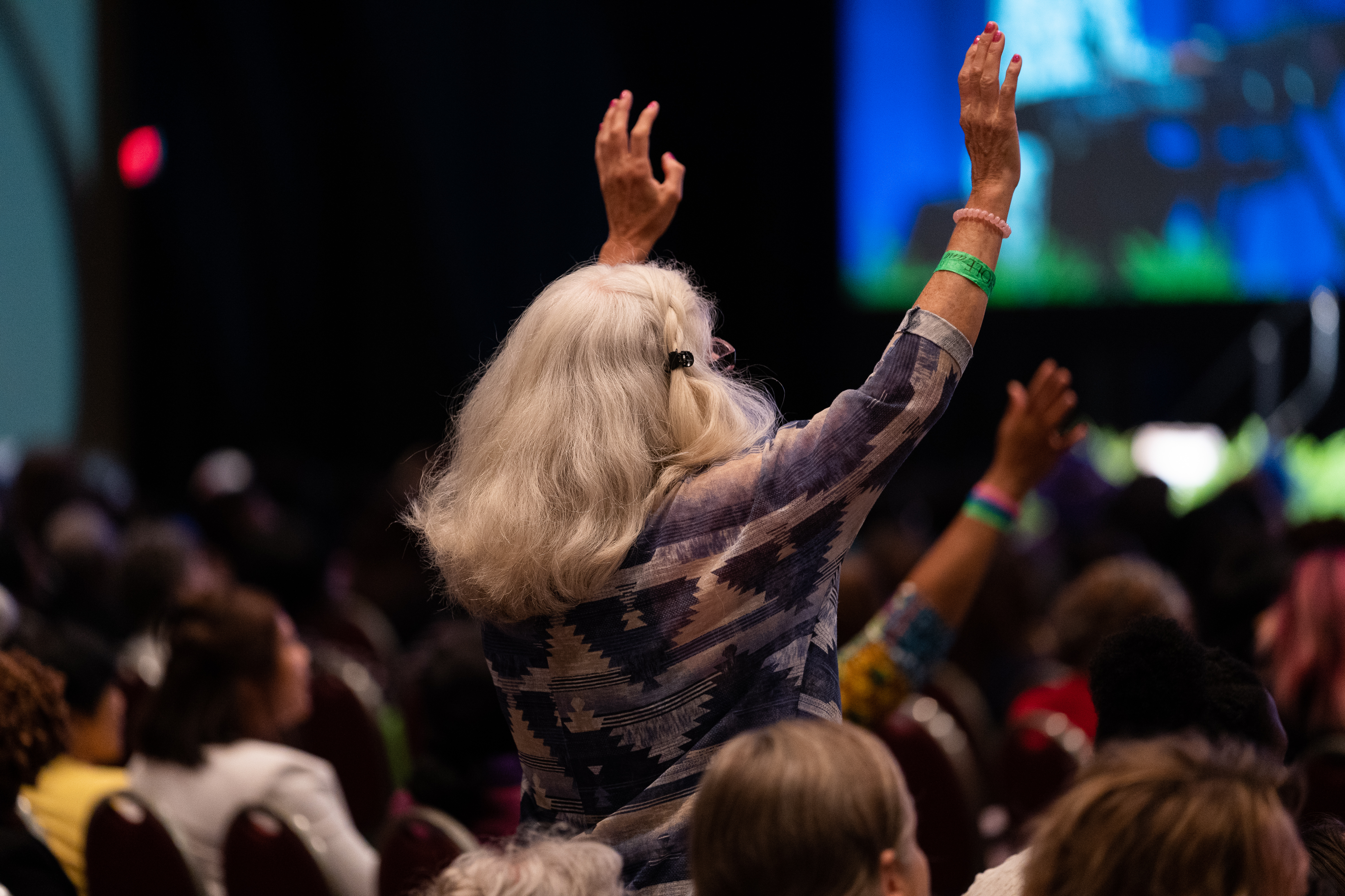 Convention attendee responds to praise and worship songs.