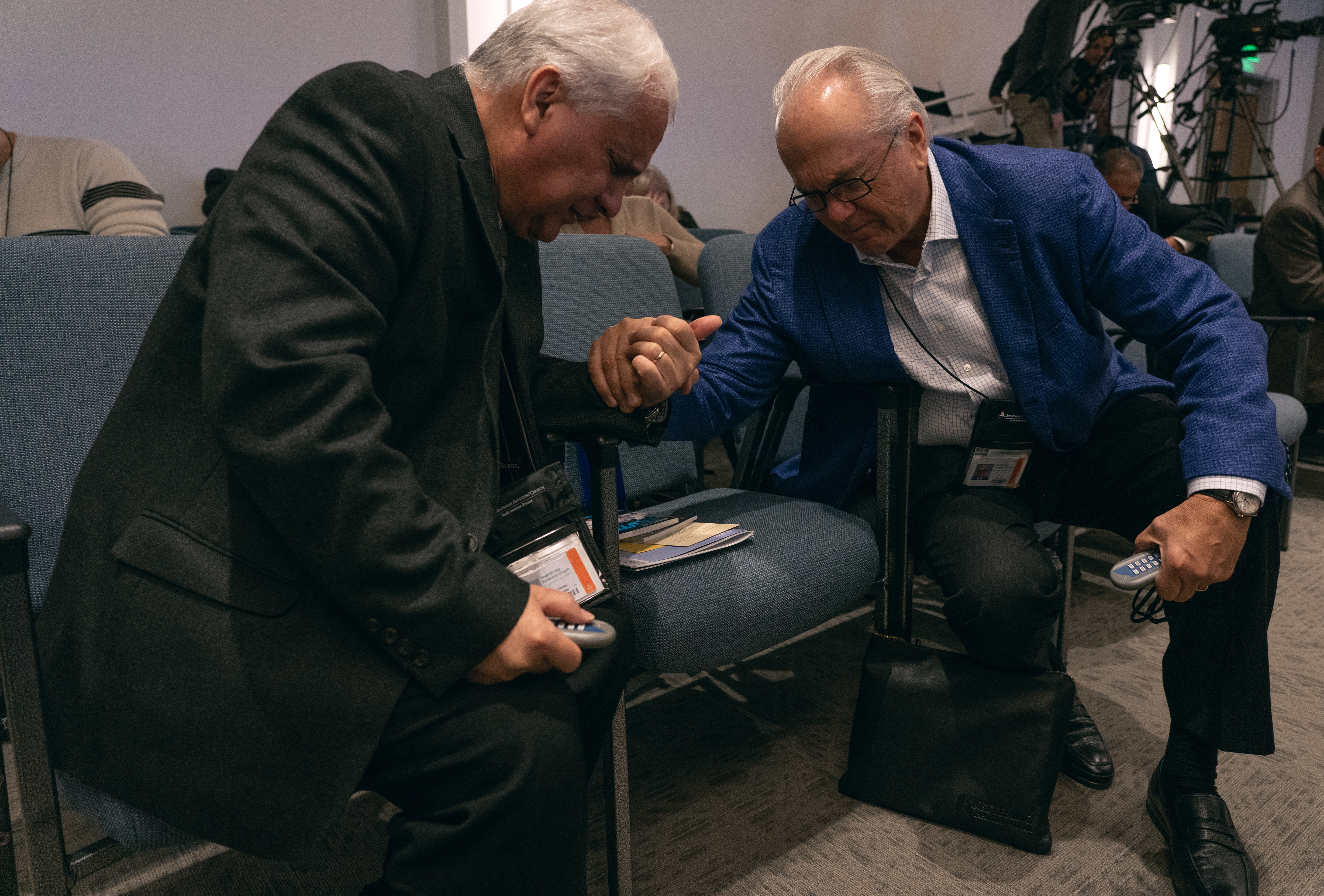 Two delegates pray before members of the NAD executive committee prepare to dialogue over how the General Conference responded to the body’s requests for action regarding the voted document from the 2018 Annual Council session dealing with non-compliant Church entities, and NAD’s financial parity. 