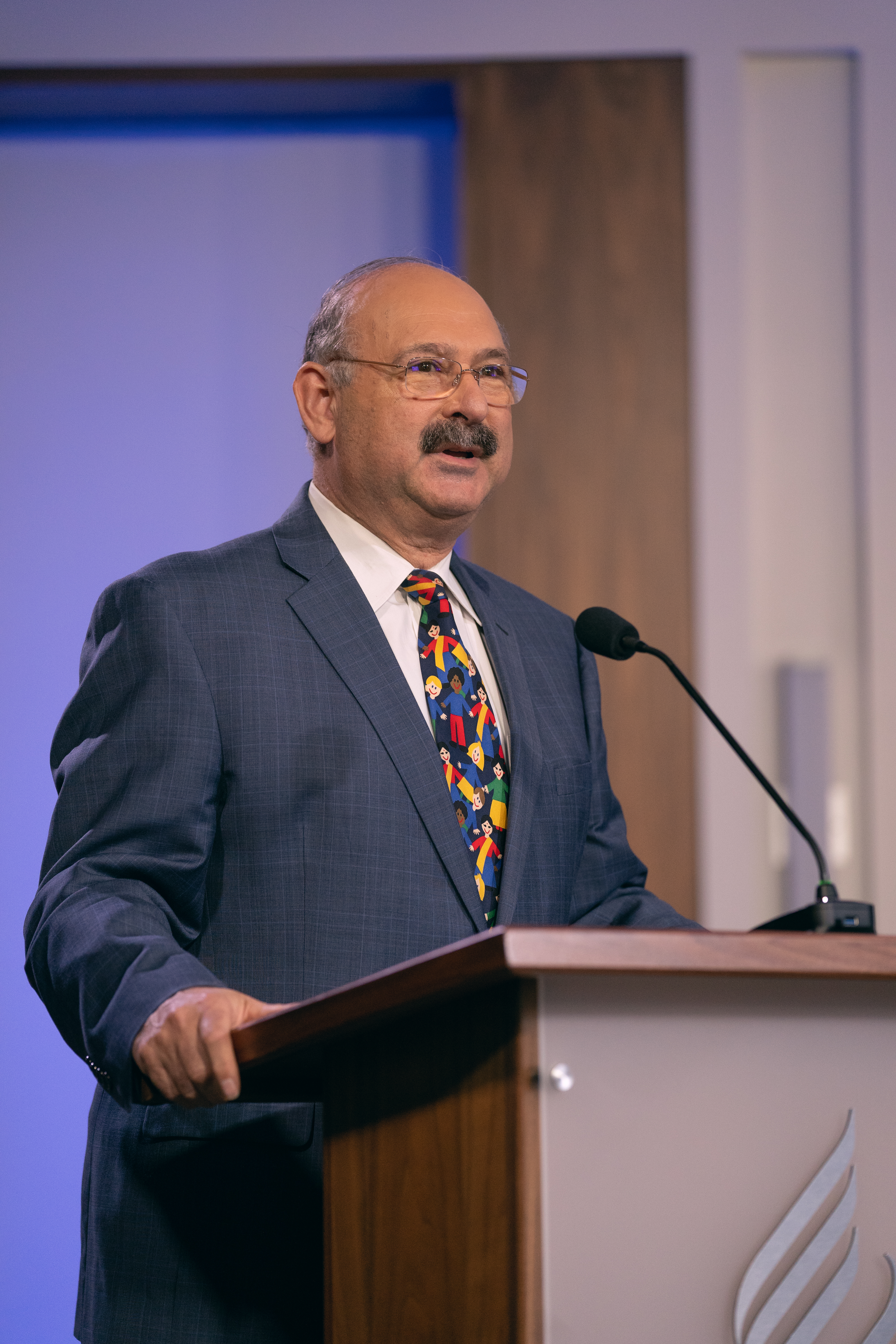 Karnik Doukmetzian, general counsel of the General Conference and the North American Division, provides explanation on the North American Division Corporation of Seventh-day Adventists as Executive Committee members vote to amend its bylaws and vote in its board of directors. Photo: Pieter Damsteegt/NAD Communication Production