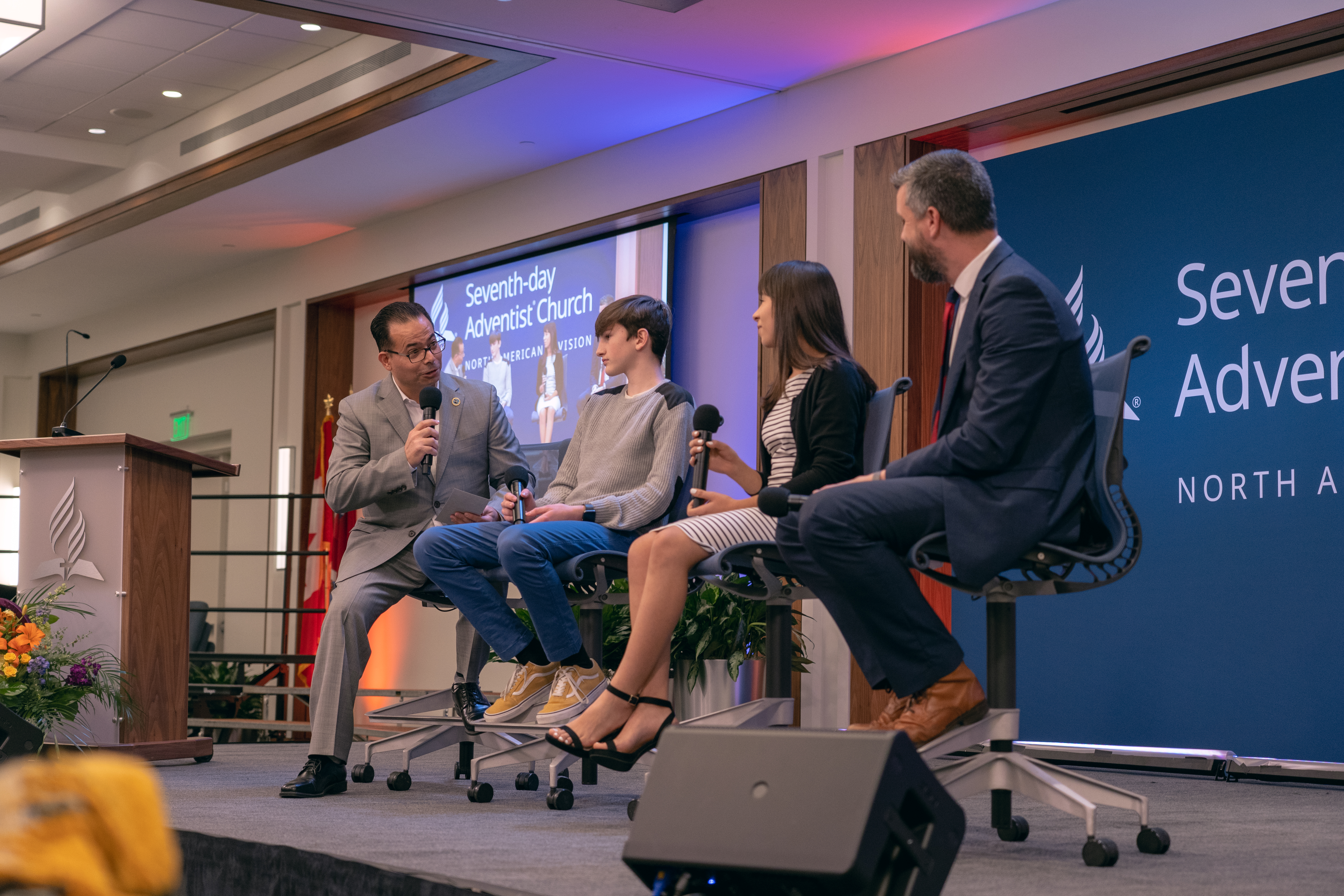 José Cortes Jr., an associate director of the NAD Ministerial Association, engages with students from Berrien Springs, Michigan who spoke for an evangelistic series at their school. 