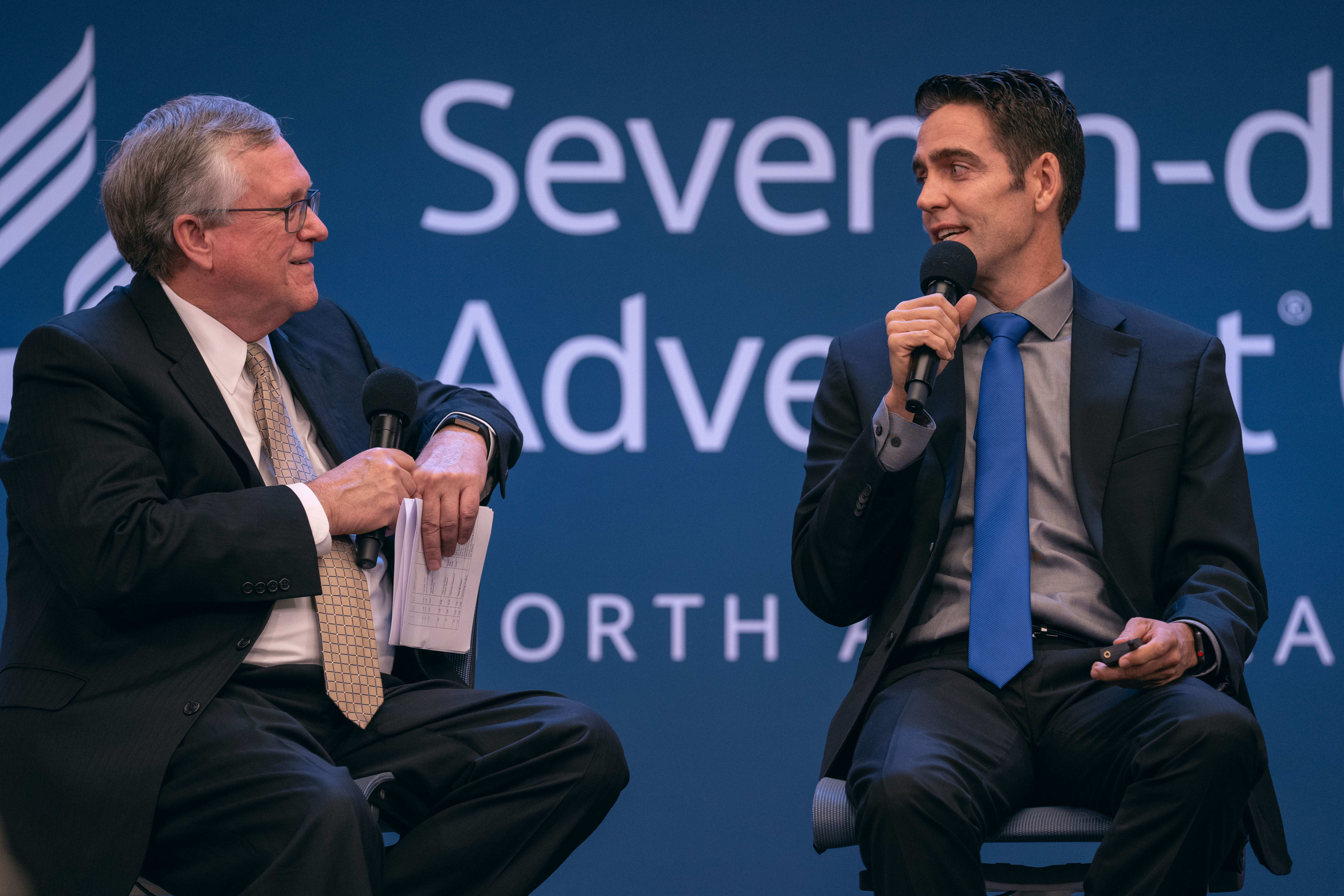 Kenneth Denslow (left), executive assistant to the NAD president, interviews Garrison Chaffee (right), pastor of the Paradise California Seventh-day Adventist Church, which was destroyed in the fires that devastated the city of Paradise.