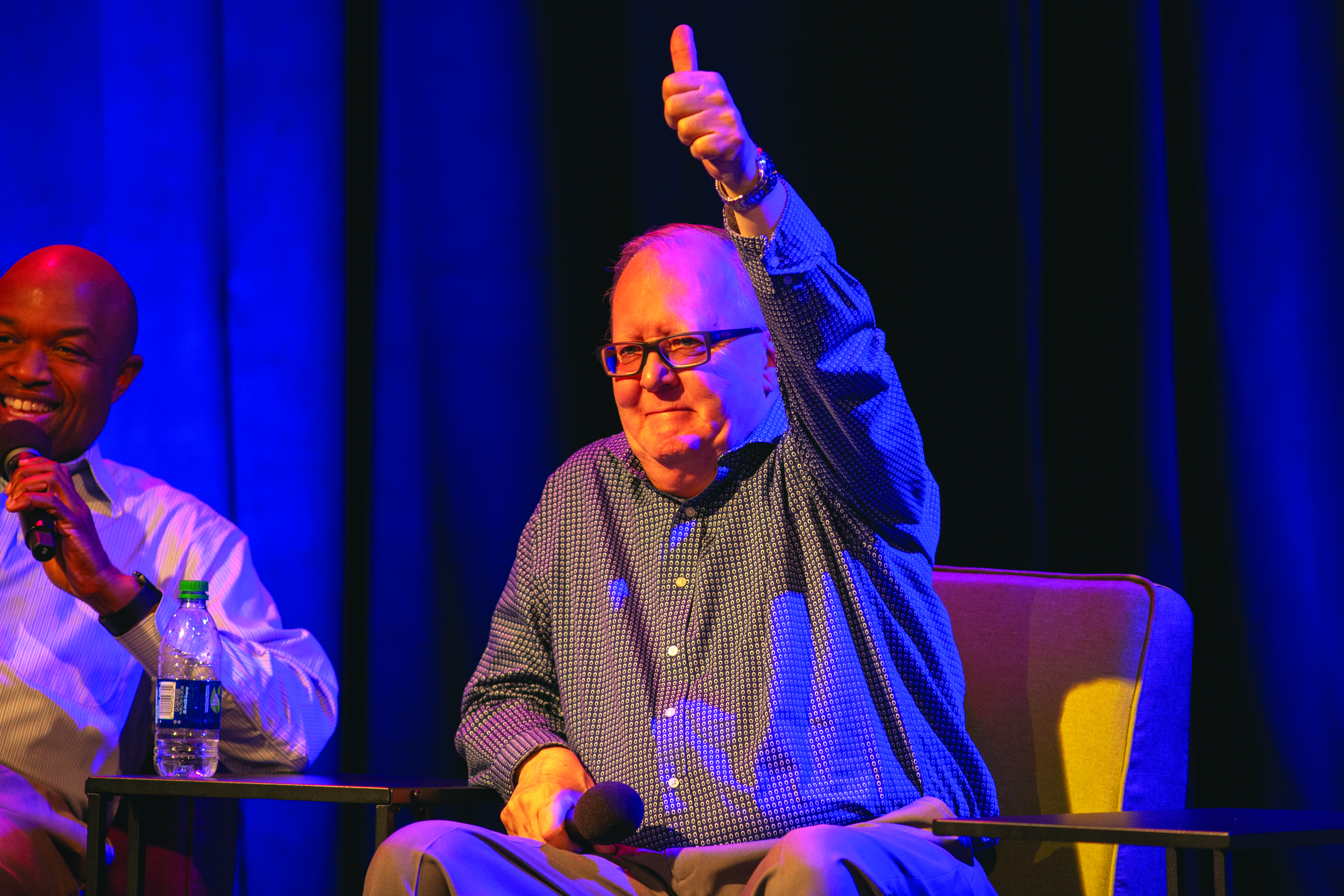 At the live-streamed event, Is This Thing On? held in Berkeley, California, in 2019, Dan Jackson gives a young adult's comment a "thumbs up."