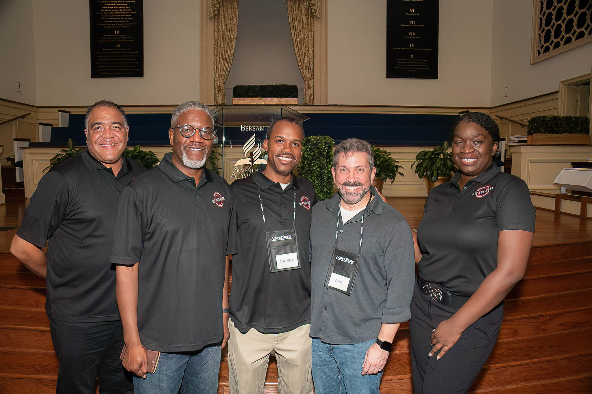 The hard-working team behind Hit the Mark Sabbath School Summit poses for a group shot. 