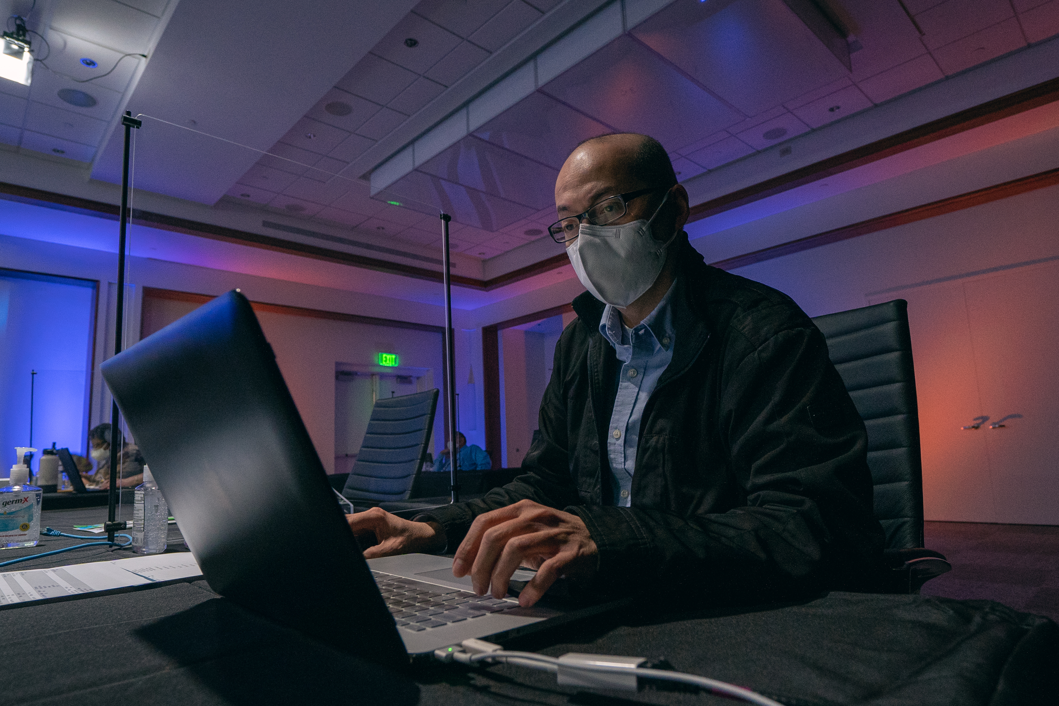 Eric Castro, MicroComputer manager for the NAD office of information technology and services, monitors the technical components of the virtual NAD Year-End Meeting. Photo: Pieter Damsteegt