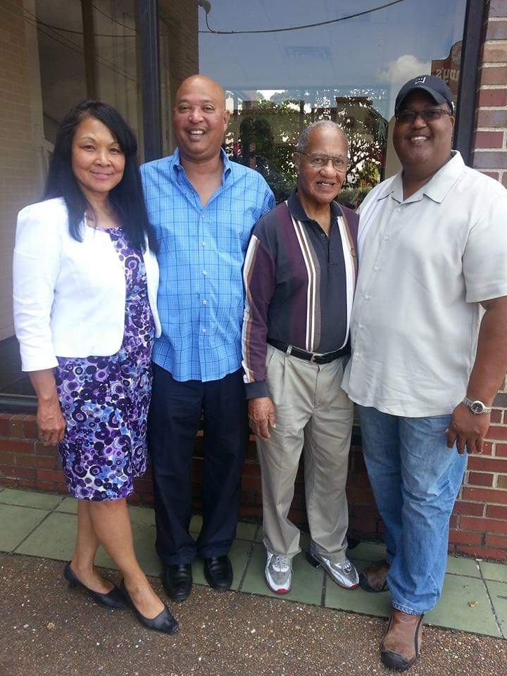 Wayne Moore poses with his wife, Dora; his father, Earl; and his brother, Eric.