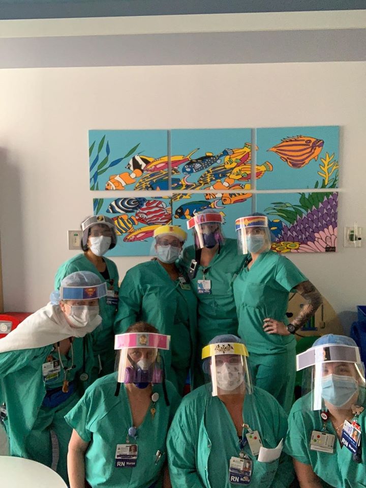 Pediatric medical personnel pose behind protective personal equipment at Howard County General Hospital