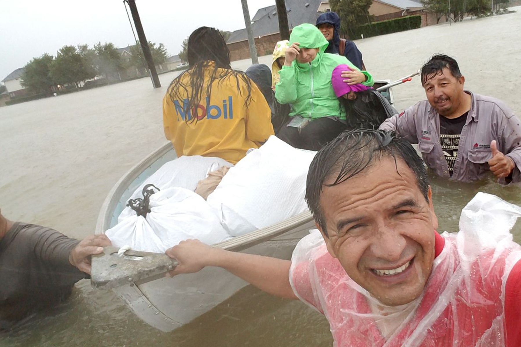 Pastor Exiquio helping