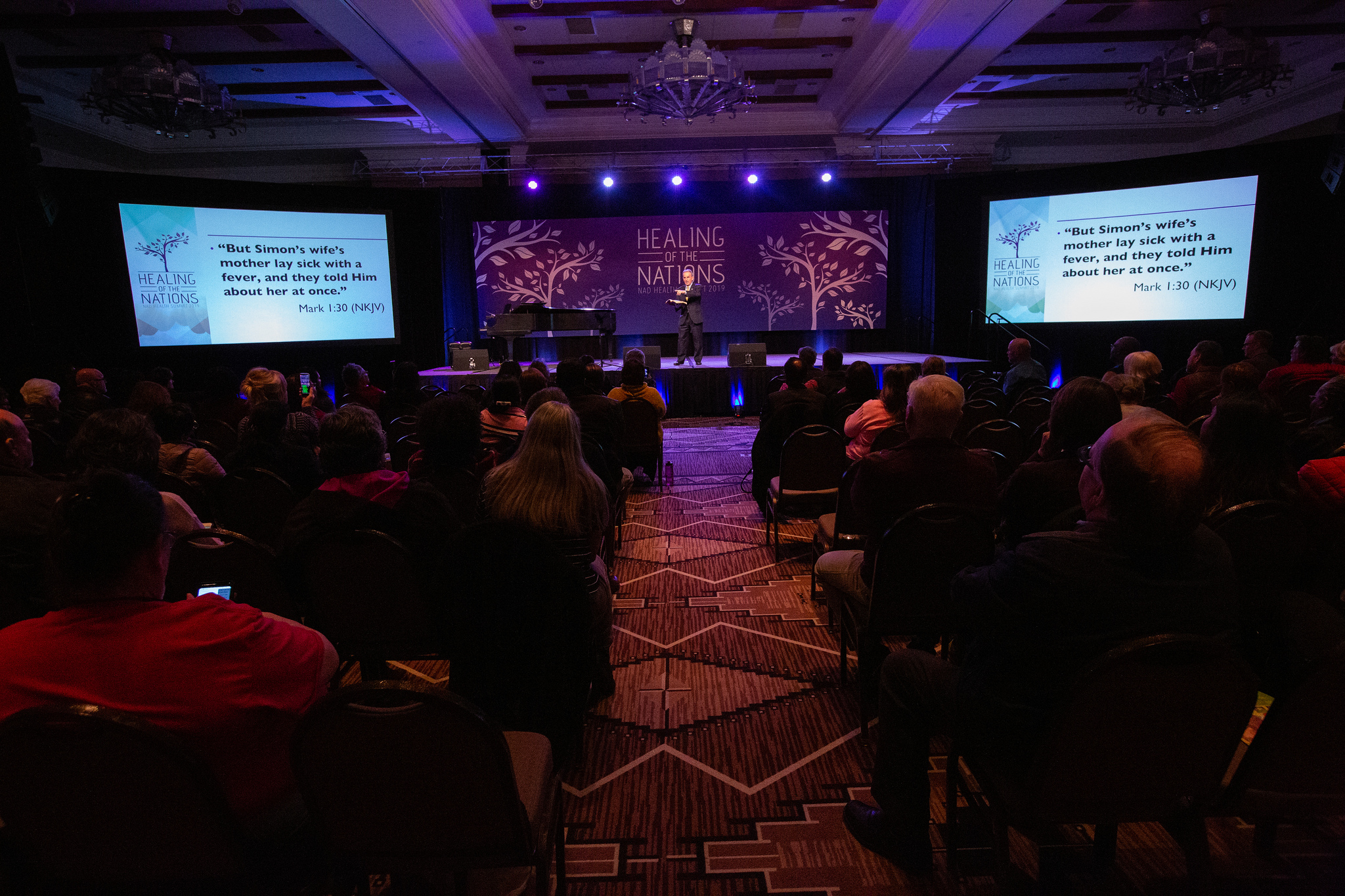 Health Summit attendees listen to devotional delivered by Derek Morris, president of Hope Channel International.