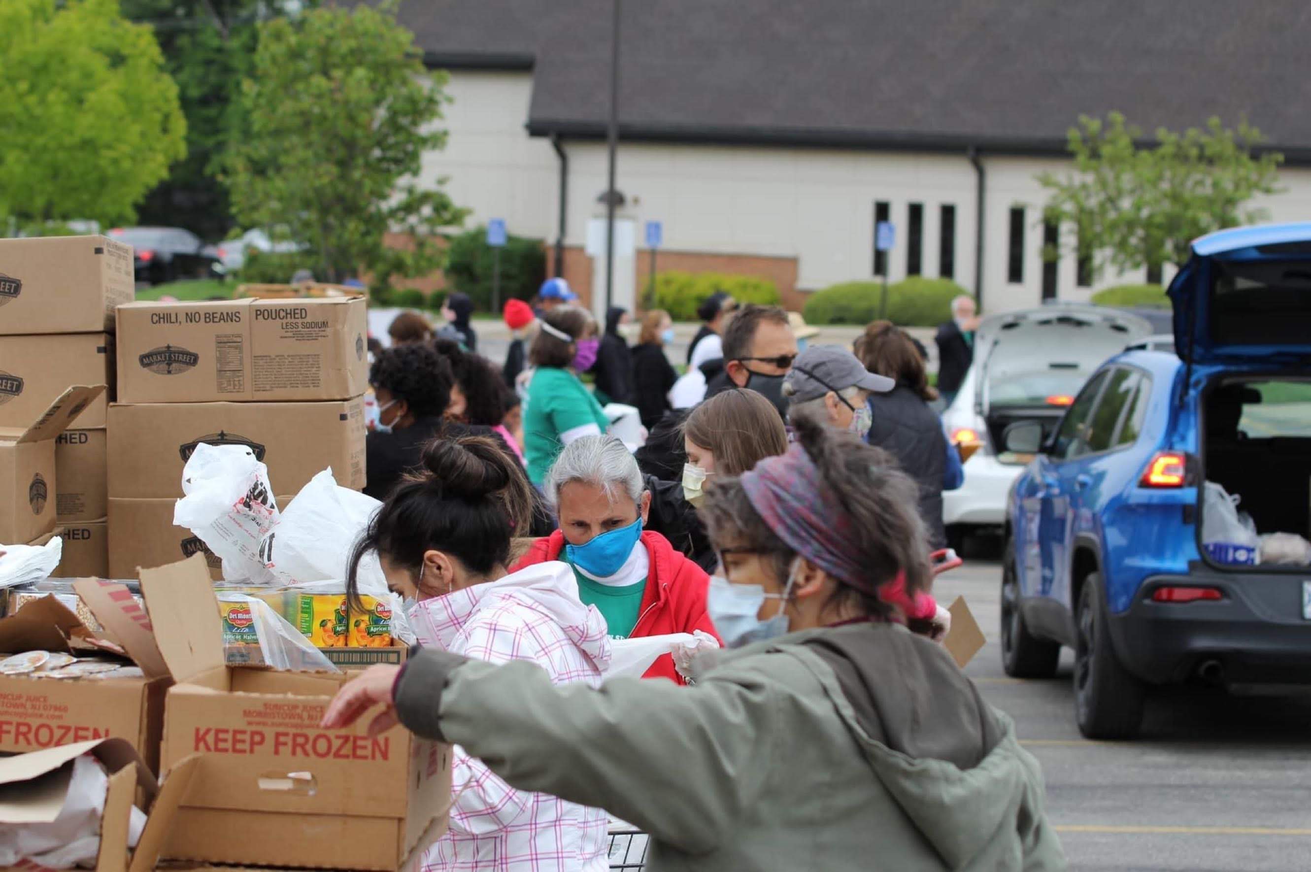 Renewed Hope volunteers sort food for distribution. 