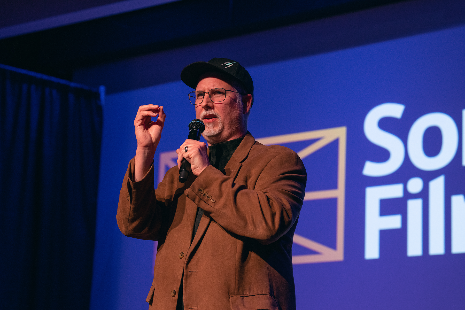 Close-up of a man speaking at a convention