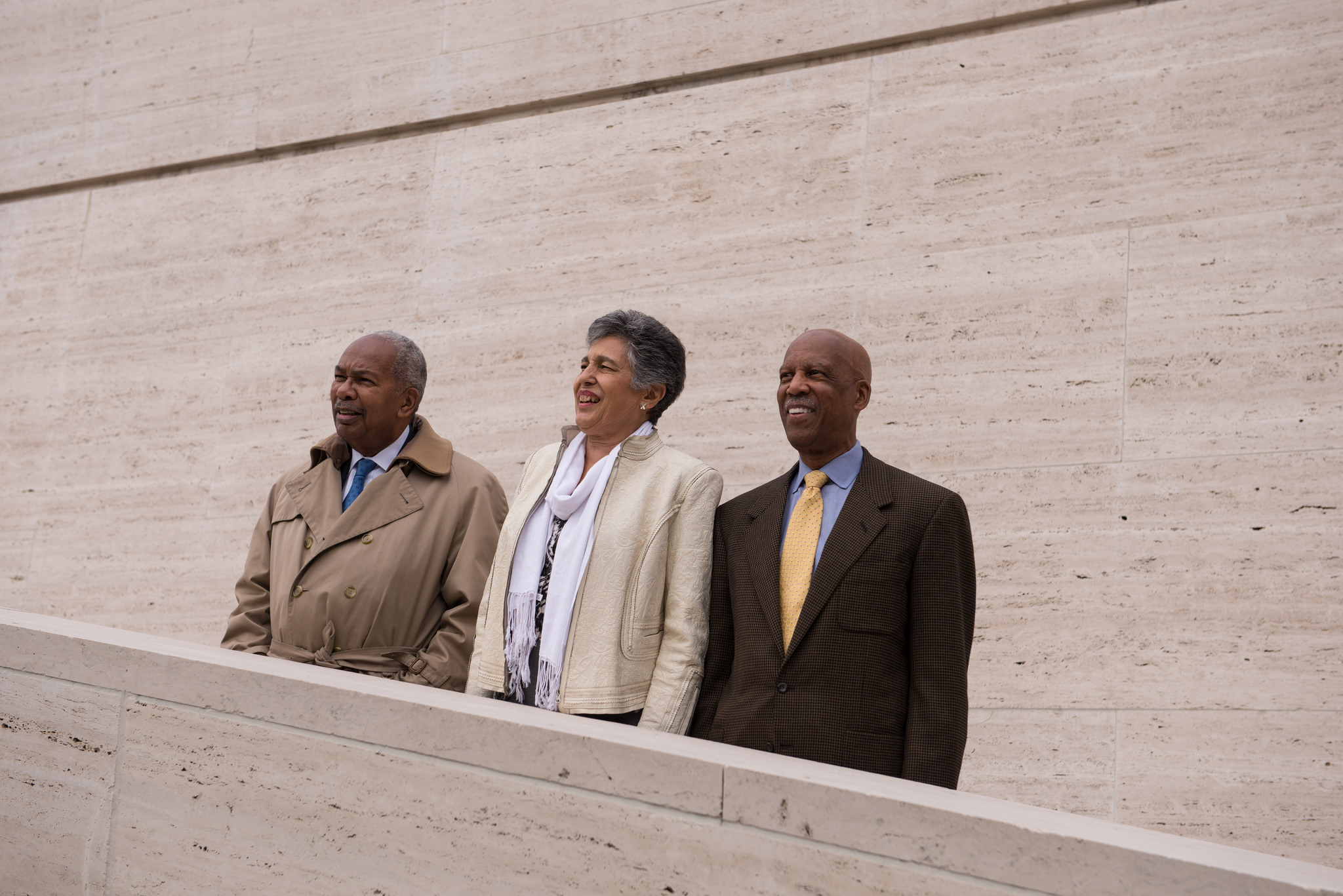 Three members of the “Little Rock Nine” - Ernest Green, Carlotta Walls LaNier, and Terrence Roberts - stand together on the steps of the LBJ Presidential Library on November 13, 2014. Photo by Lauren Gerson.