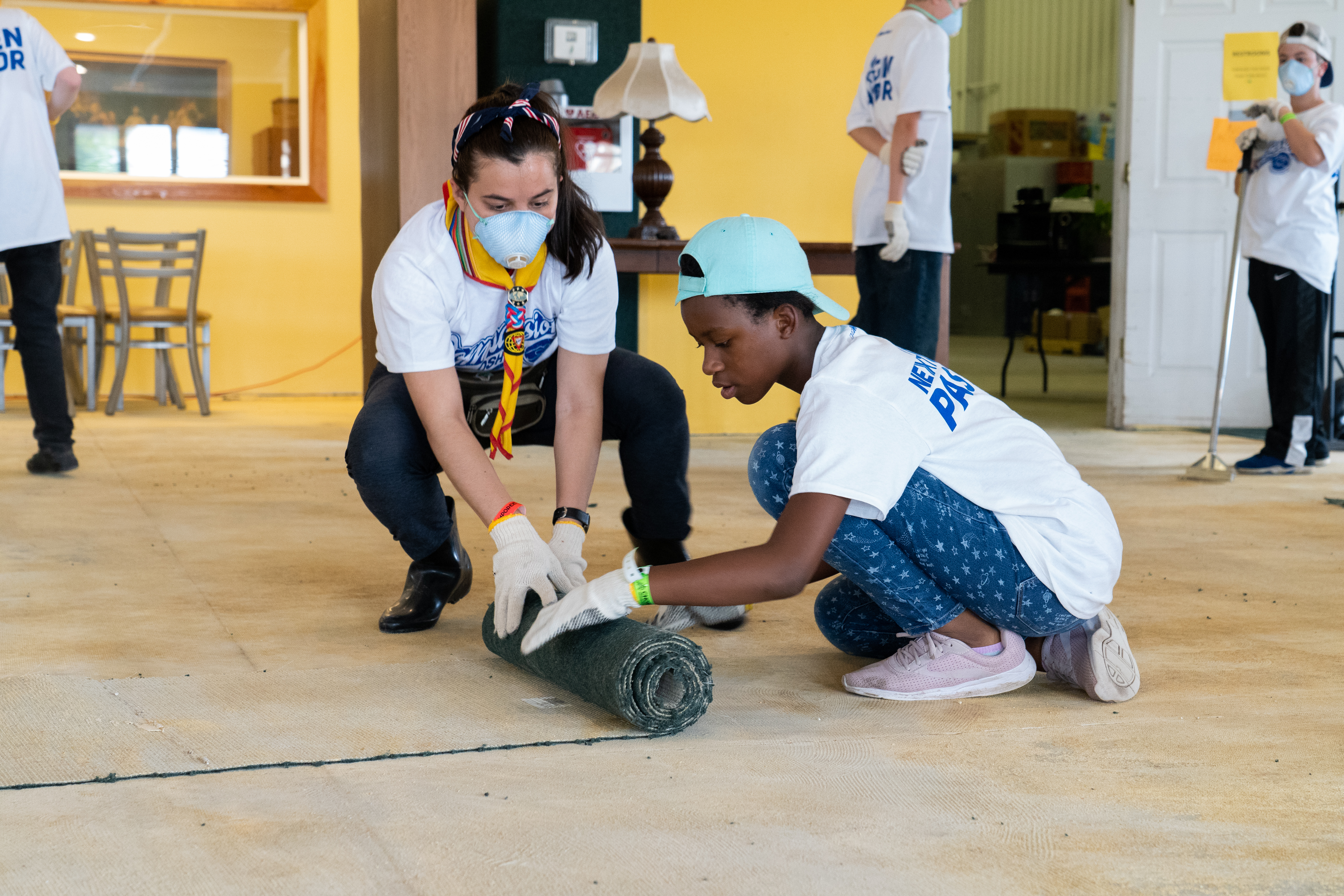 Other clubs learned new skills as they completely removed the old carpet at Father Carr’s Food Pantry and helped fix air conditioners at the facility’s women’s shelter.