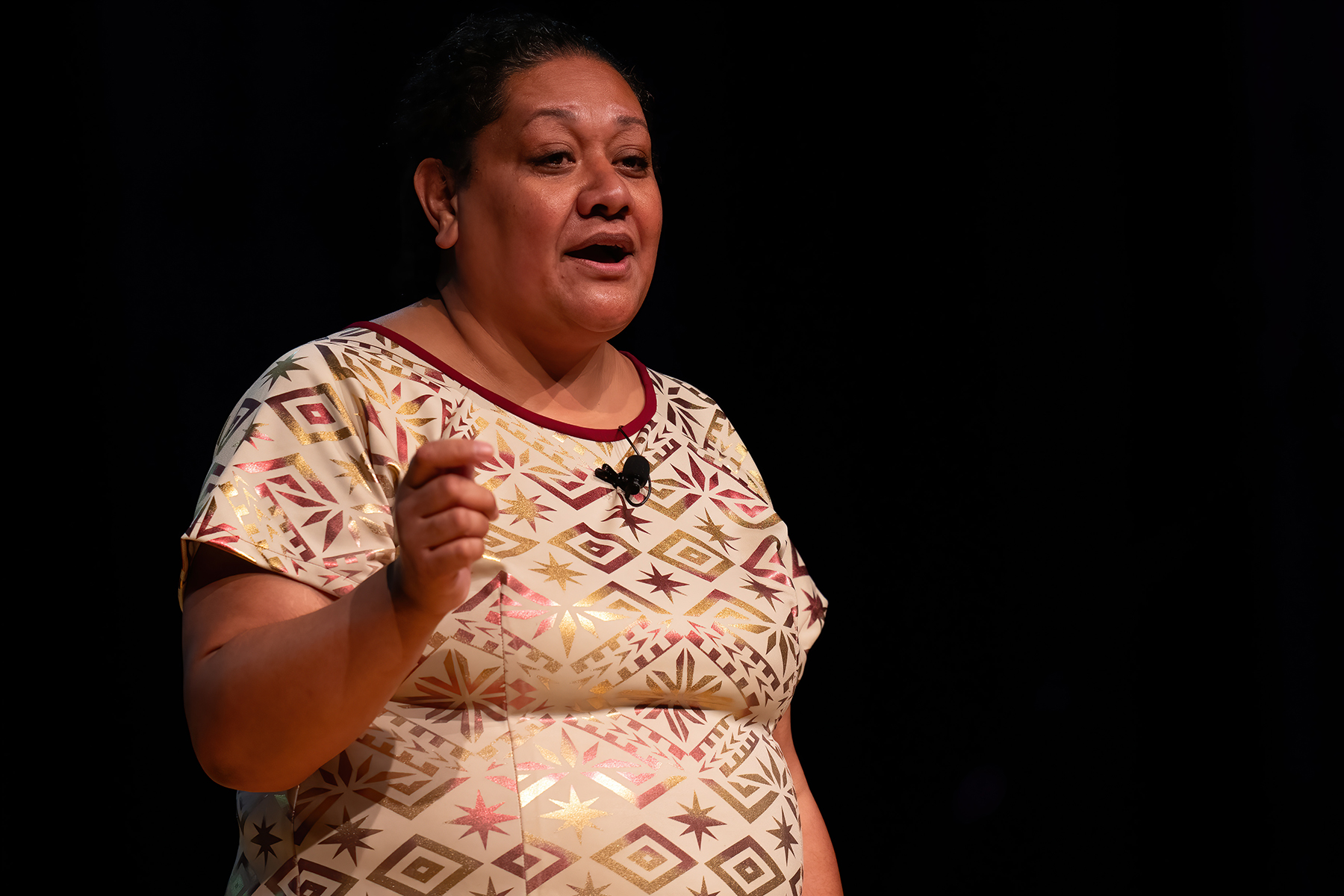 Close-up of a Samoan lady speaking to an unseen crowd