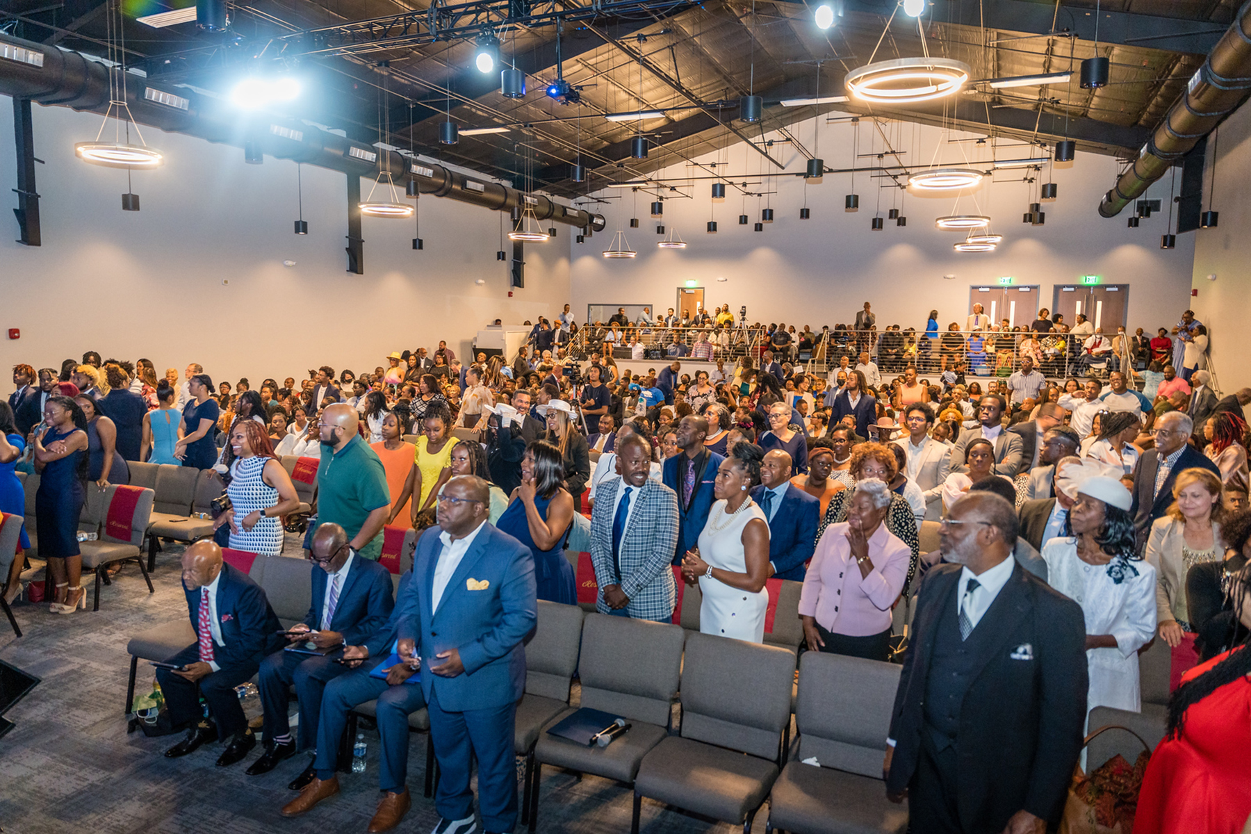 A large crowd of people in an auditorium