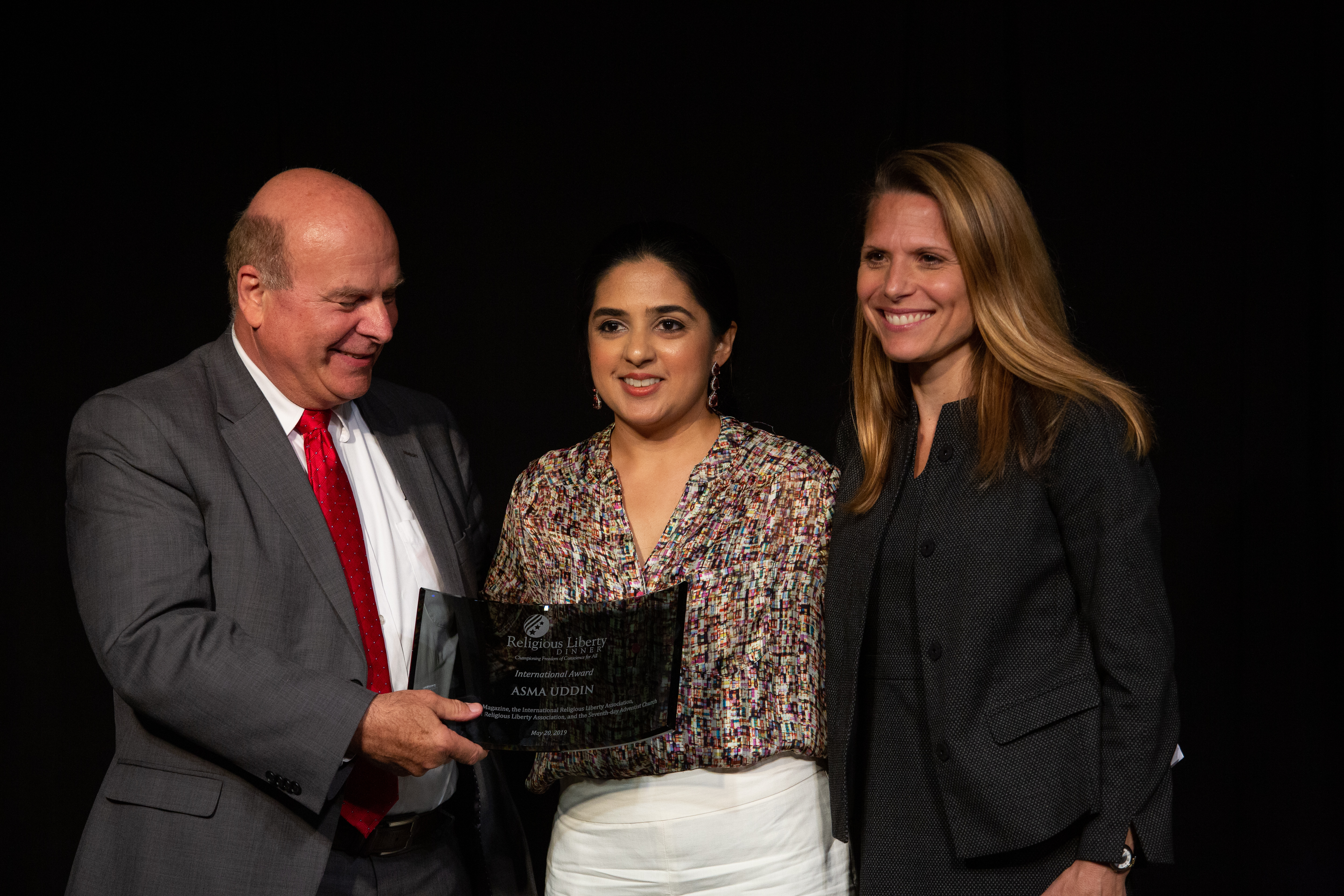 Asma T. Uddin accepts an International Award.