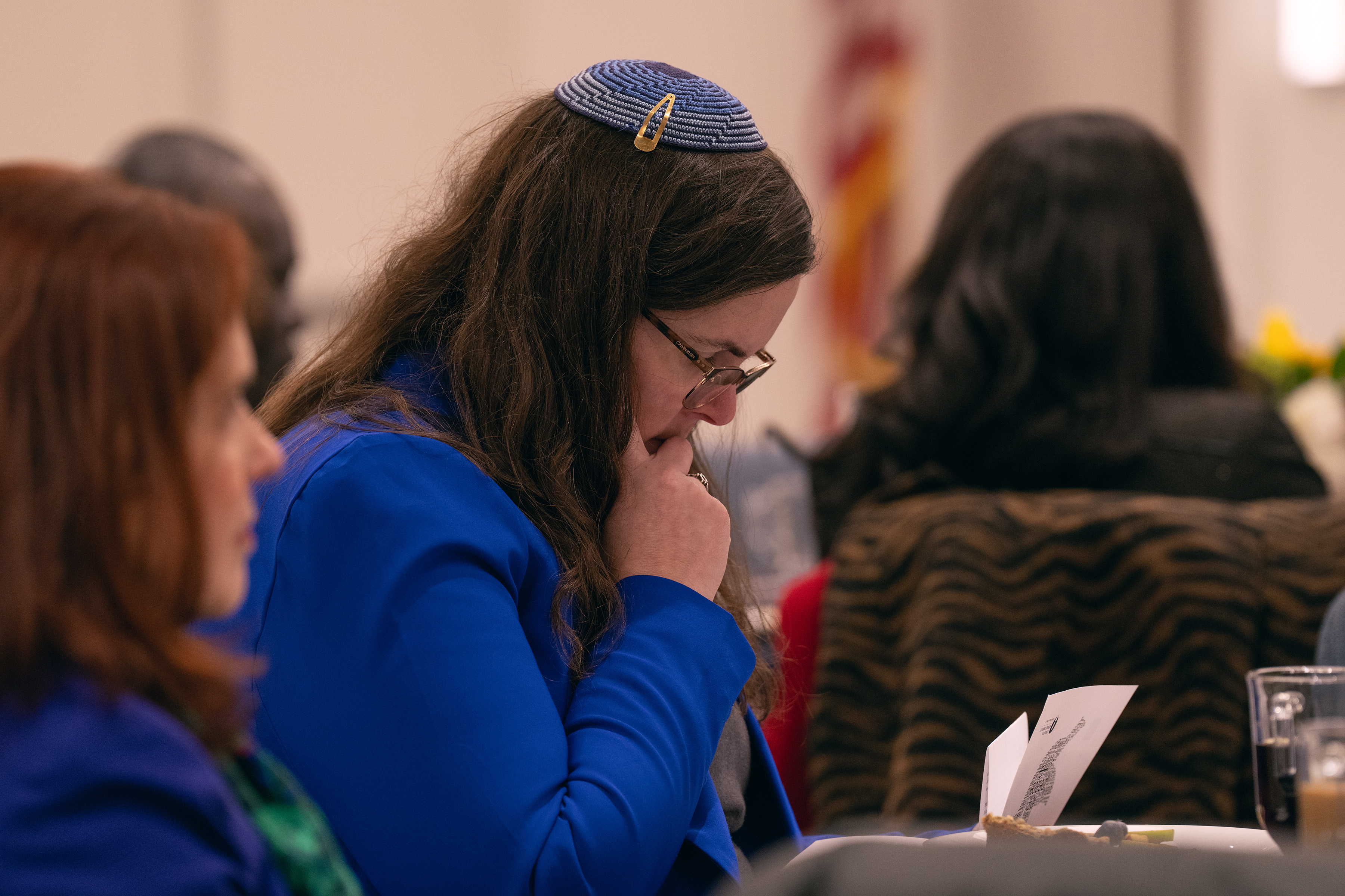 White woman in blue suit, wearing a yarmulke