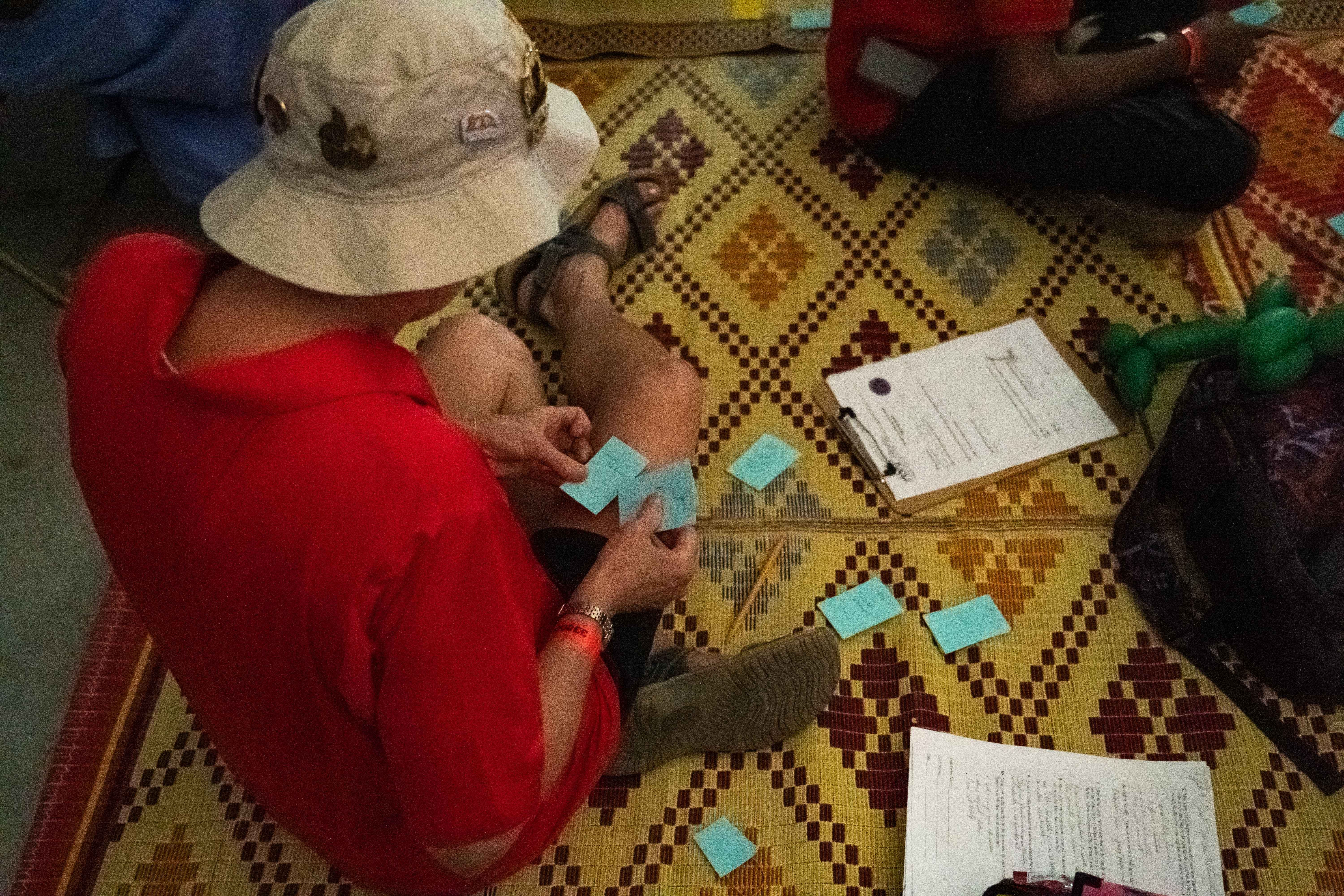 A participant of the “Refugee Assistance Honor” class carries out instructions from the loss simulation exercise, which allows attendees to imagine what life is like as a refugee.