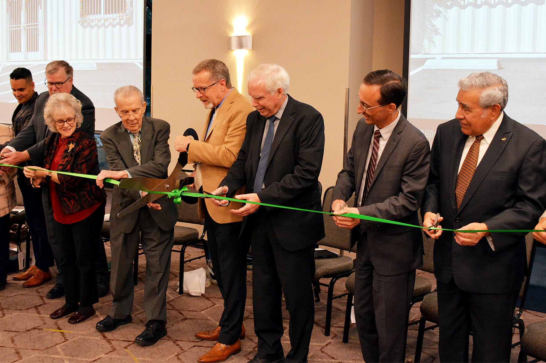 Randy Roberts, senior pastor of Loma Linda University Church, mans the oversize scissors as he and the other dignitaries prepare to cut the ceremonial ribbon for the Loma Linda University Church Literature Ministry Distribution and Training Center. 