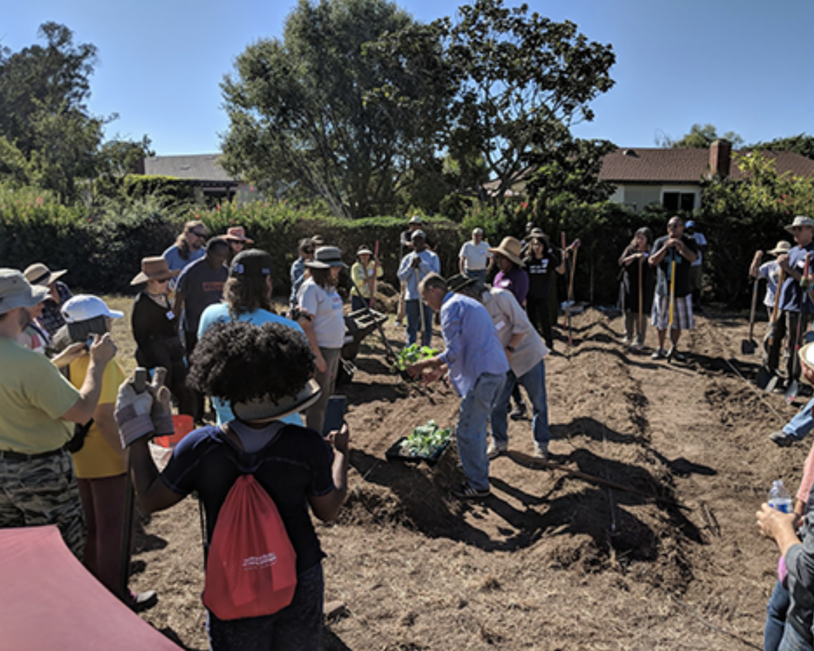 Hoag gives planting instructions to the community and church members who showed support for a community garden by attending the first garden workshop in fall 2018.