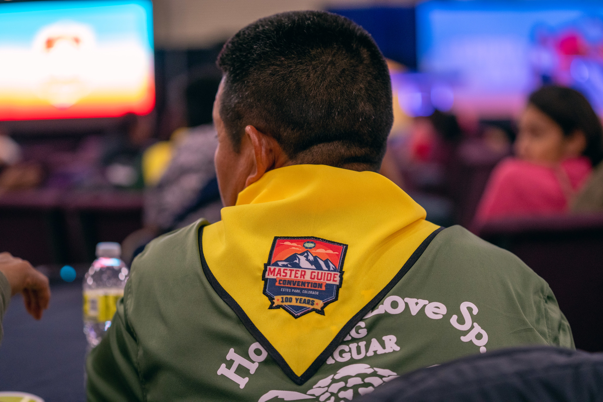 An attendee wears a pathfinder scarf emblazoned with the 100-year anniversary Master Guide Convention logo. Photo by Pieter Damsteegt | North American Division
