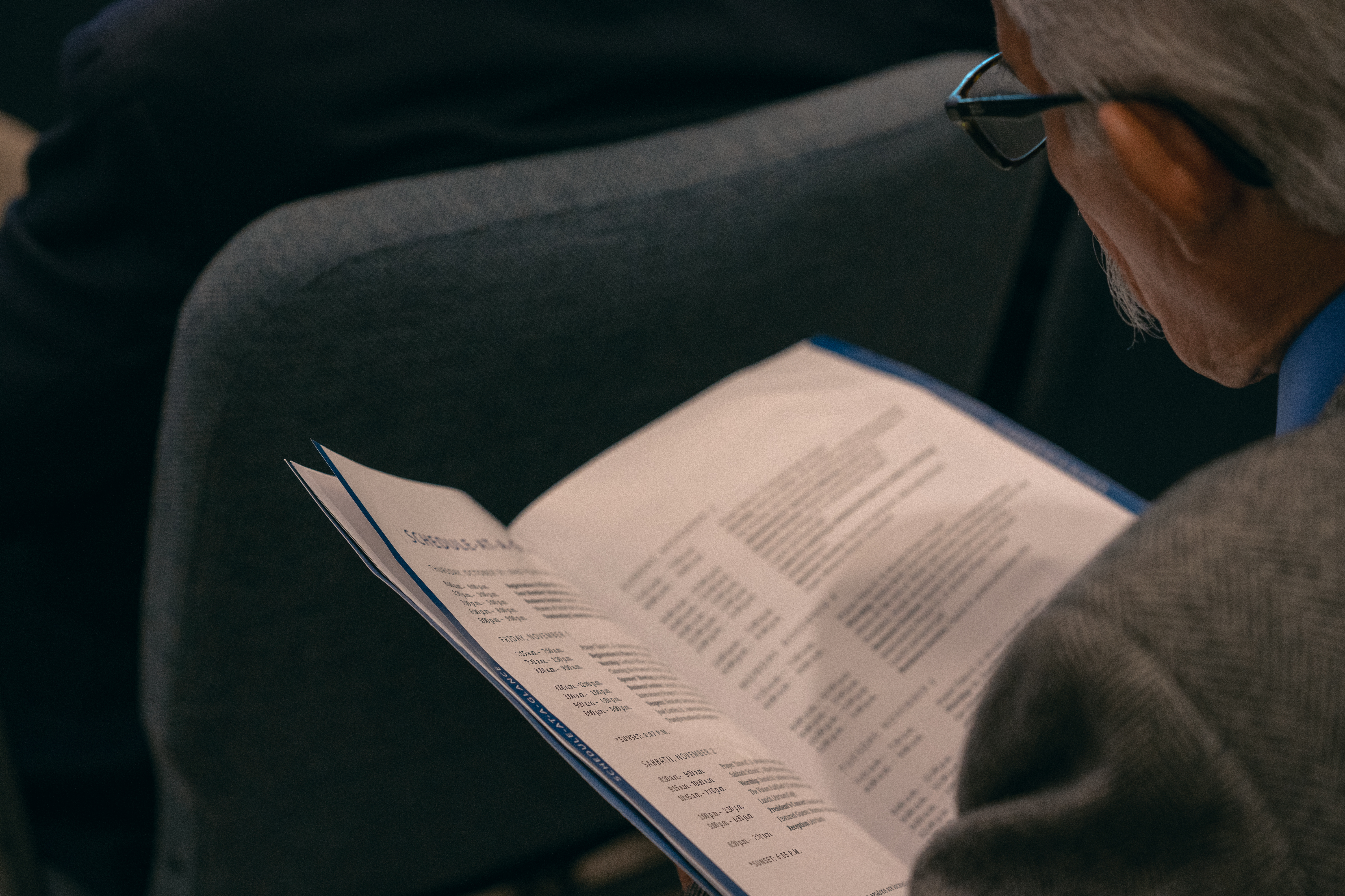 A delegate glances at the schedule for the 2019 YEM of the North American Division.