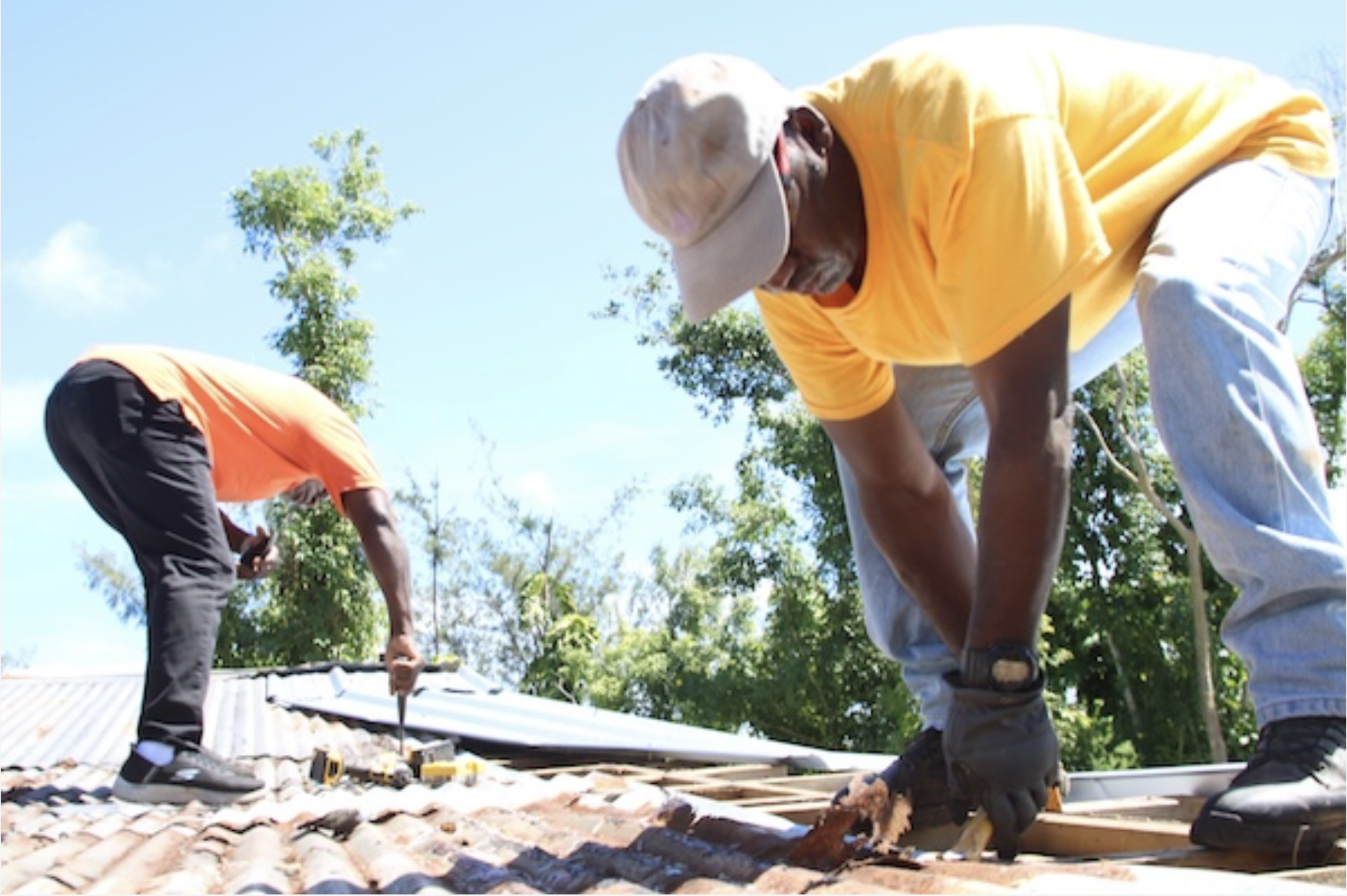 ACS volunteers help repair a roof on a house in Guam in fall 2023