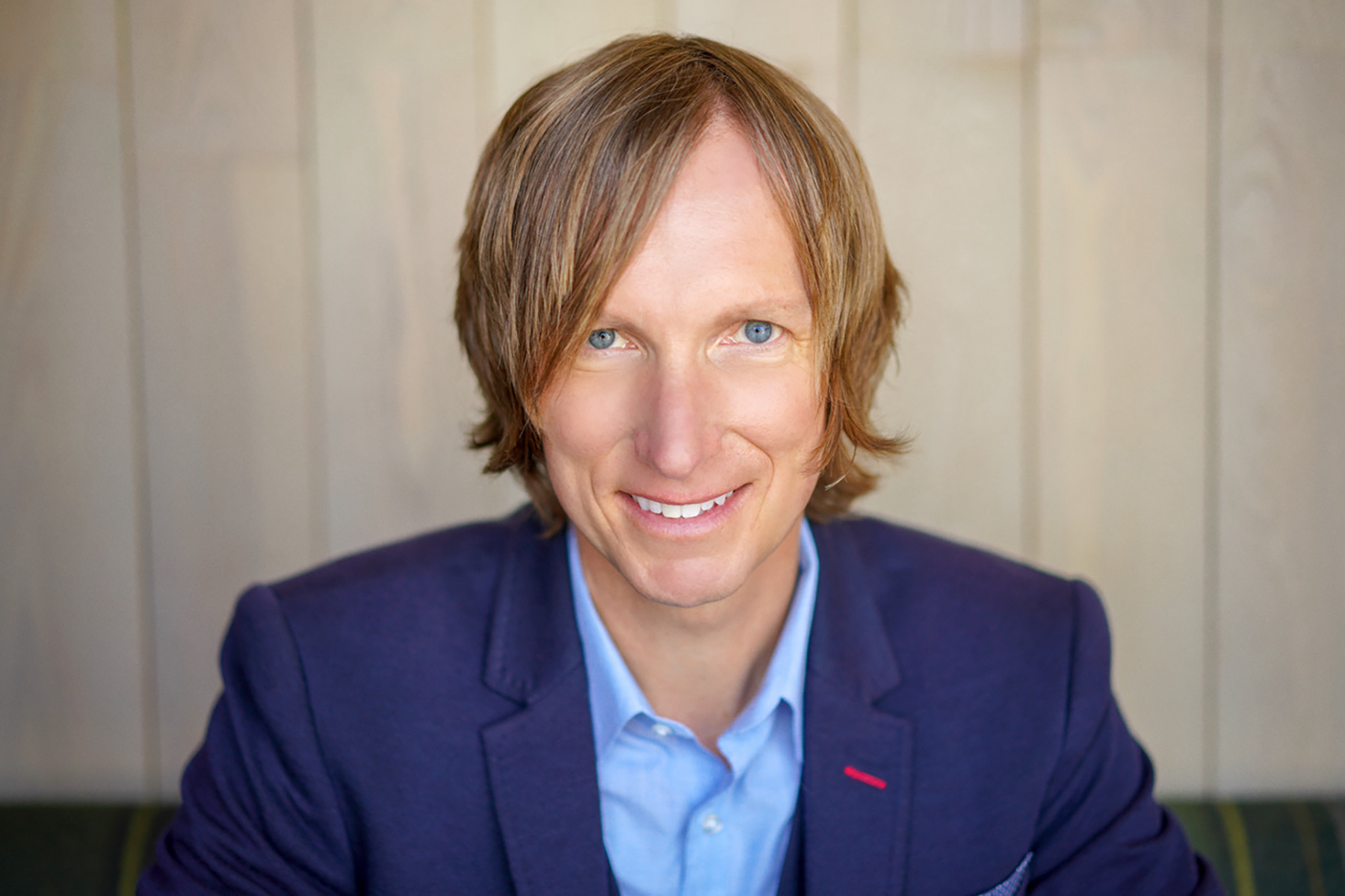 headshot of white man with dirty blond hair