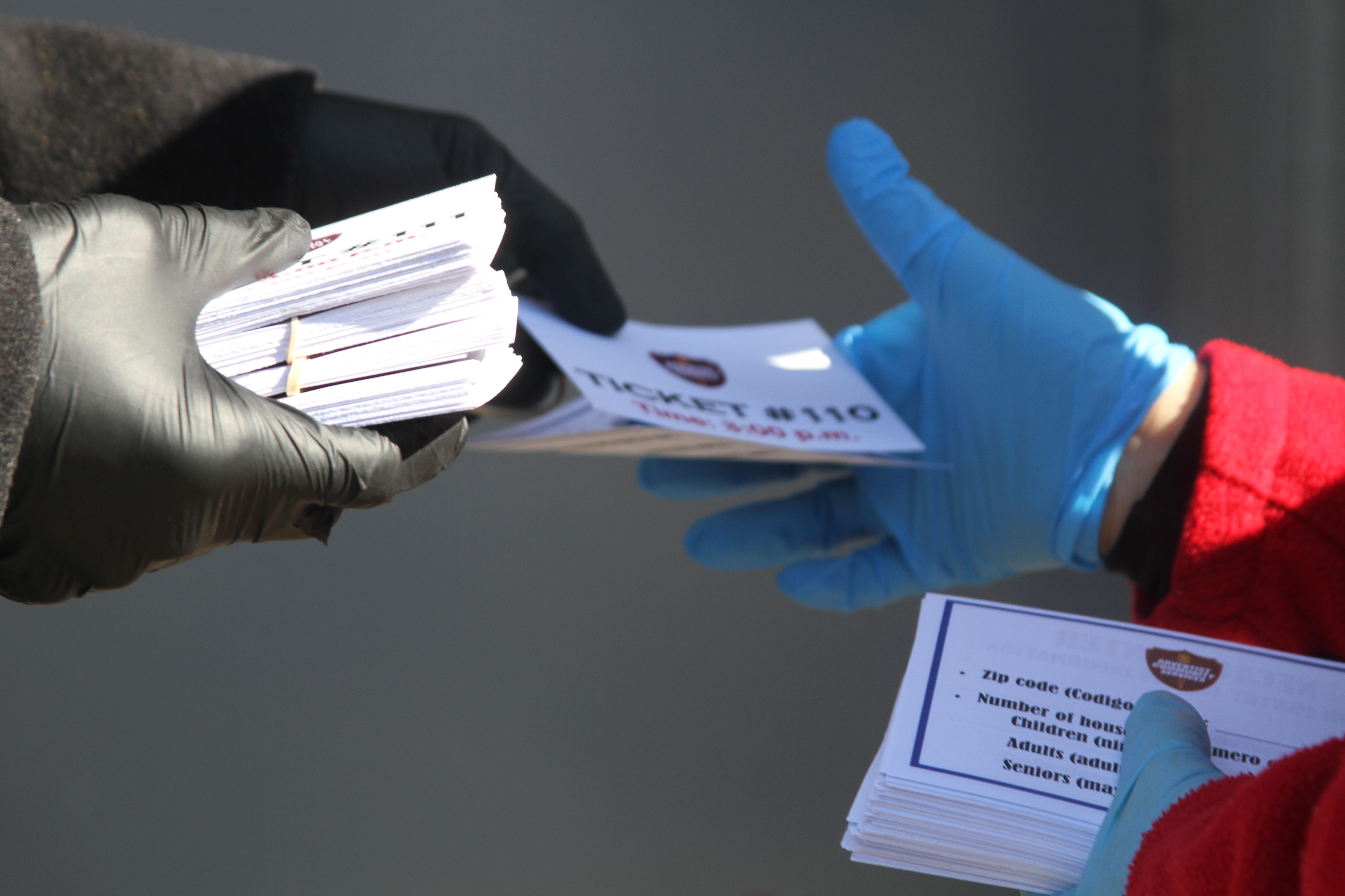 NECACS uses a ticket system to distribute their free food packages. Photo by JeNean Lendor