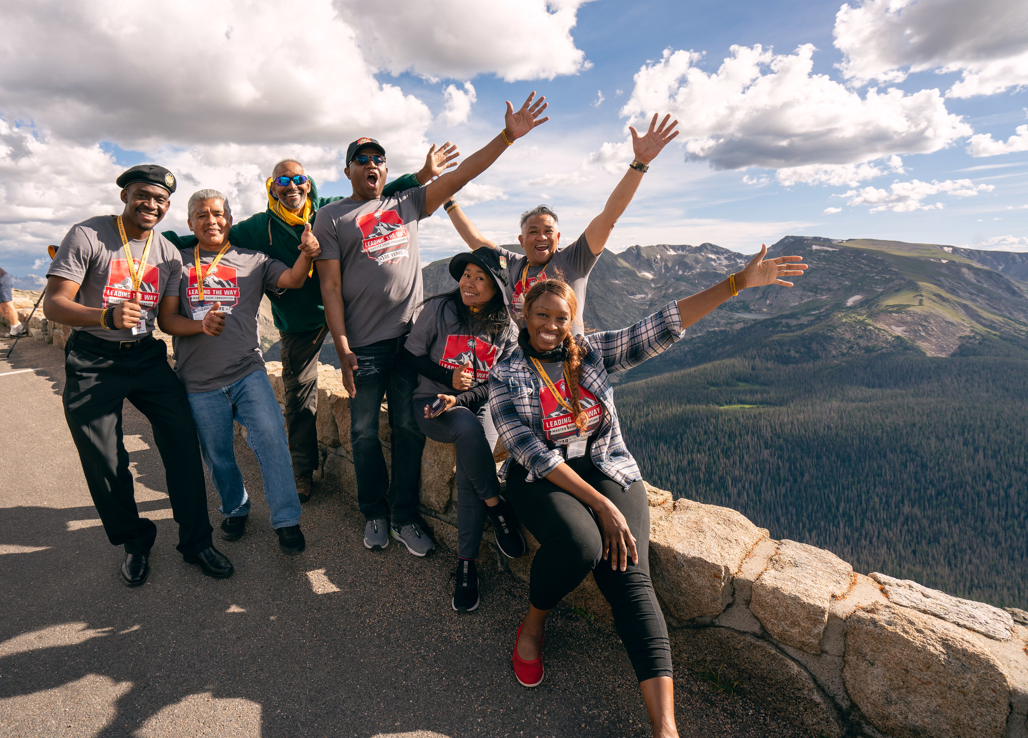 A group of Master Guides wearing the official convention T-shirt celebrate at a mountain viewpoint. Photo by Pieter Damsteegt | North American Division