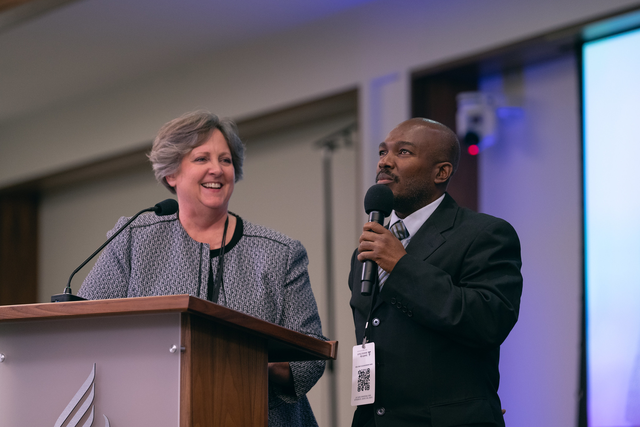 Diane Thurber, Christian Record Services president, listens in while Dexter Thomas, an Adventist motivational speaker, shares how CRS resources have had a major impact in his life.