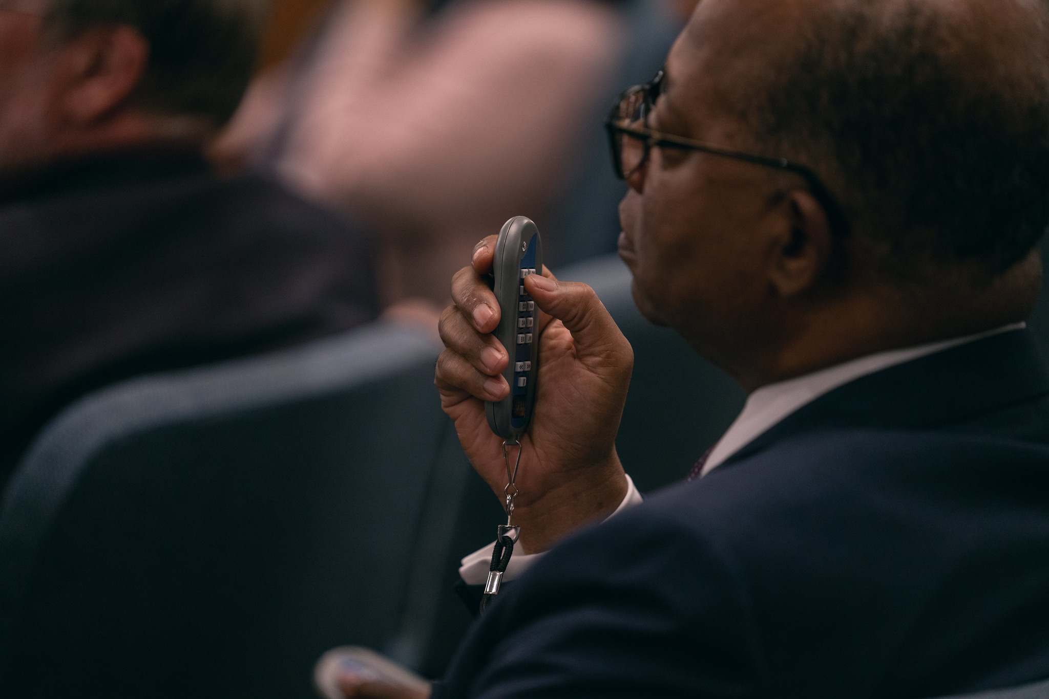 2022 NAD YEM day four photo of delegate about to vote with device