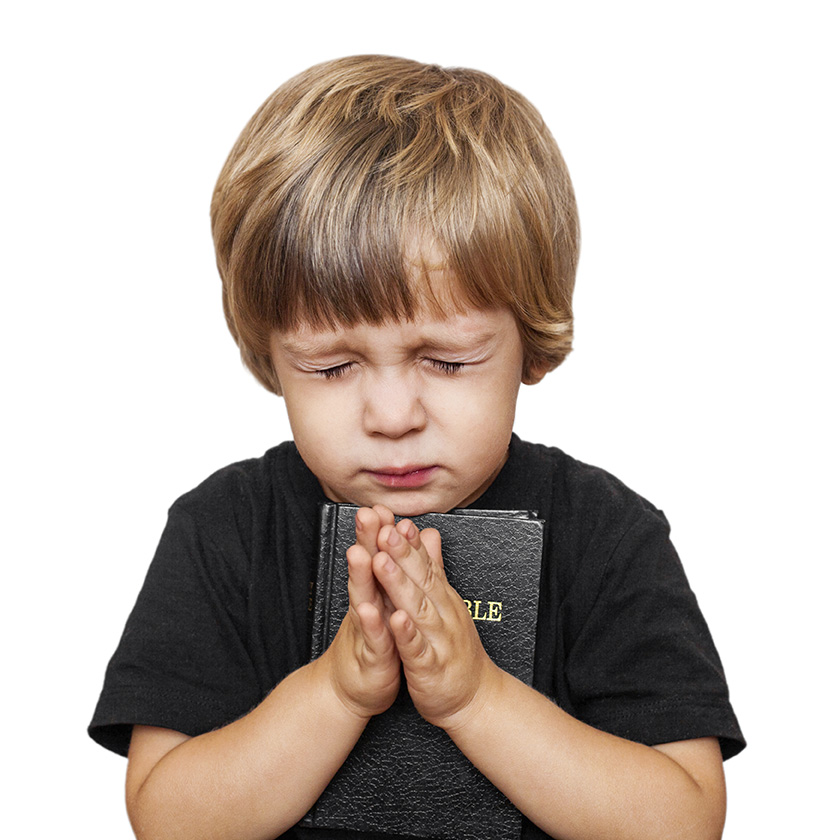 young boy praying