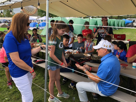 AdventHealth president/CEO Terry Shaw trades pins at 2019 Oshkosh Camporee