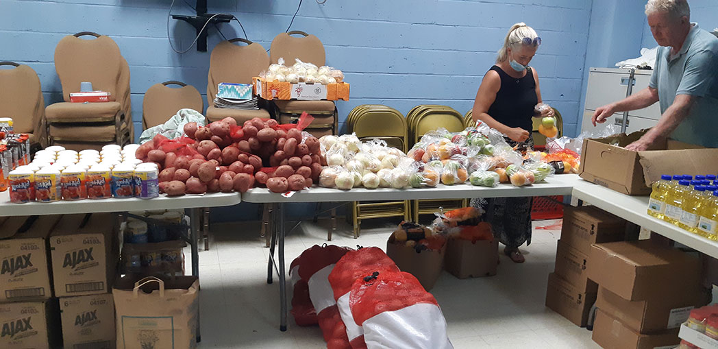 Church members set up for a grocery giveaway at St. David's Seventh-day Adventist Church in Bermuda. Photo provided by the Atlantic Union Gleaner/Bermuda Conference ACS
