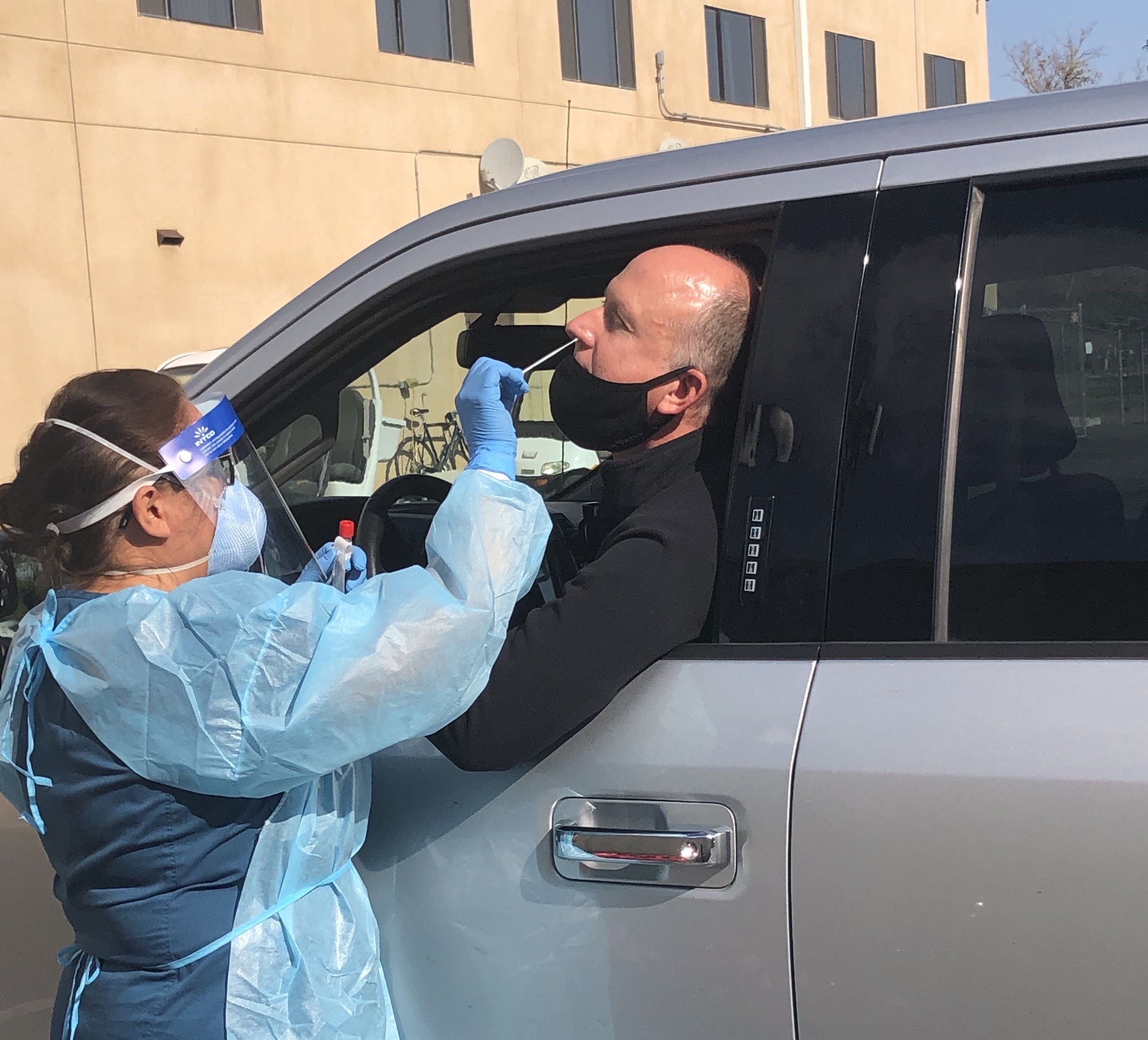 Paula Mendoza, licensed vocational nurse administers a test for COVID-19 to Student Wellness Services Director Dan Nyirady. (Photo courtesy of Student Wellness Services)