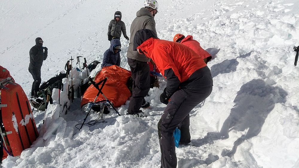 Emergency response team prepares patient for transport