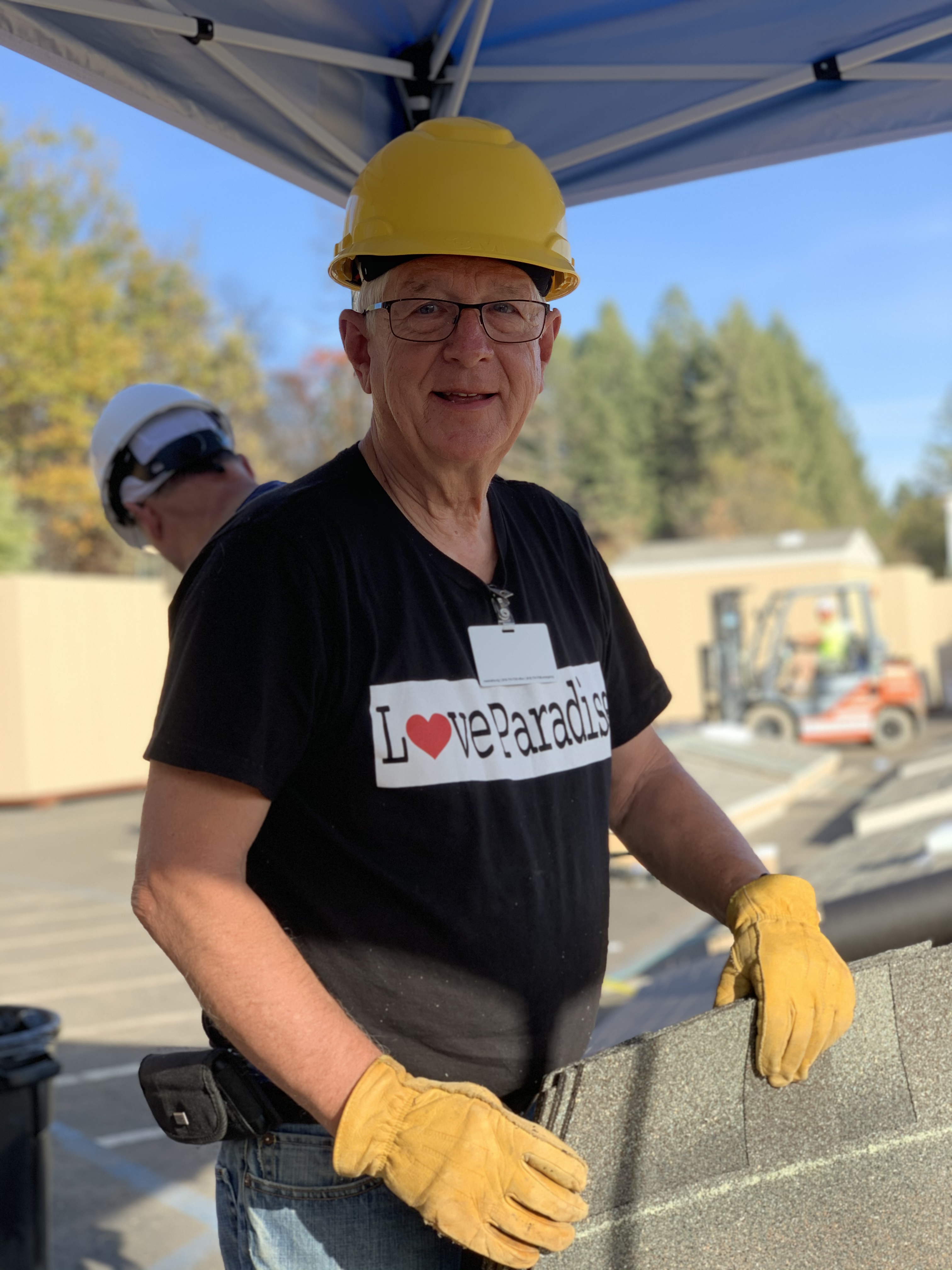 One of more than 350 volunteers helps construct a storage shed in Paradise, California. Julie Z. Lee
