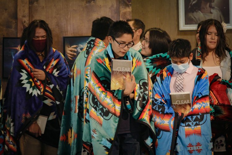 HIS students at a baptismal ceremony. “In keeping with the Holbrook Indian School belief and practice of honoring Native American culture, each student was given a Native print blanket as a gift,” the school said. Photo provided by Holbrook Indian School