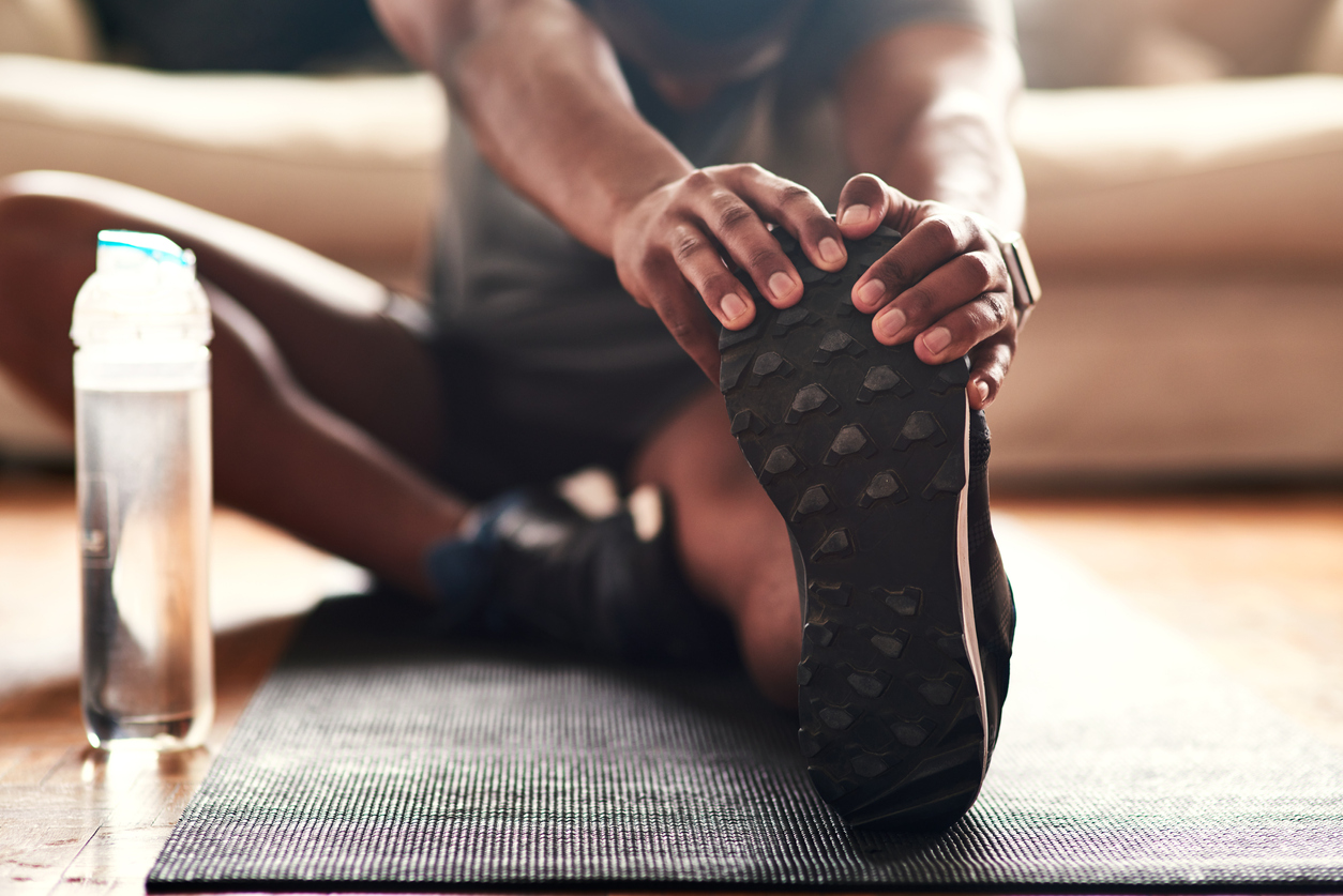 man stretching stock photo