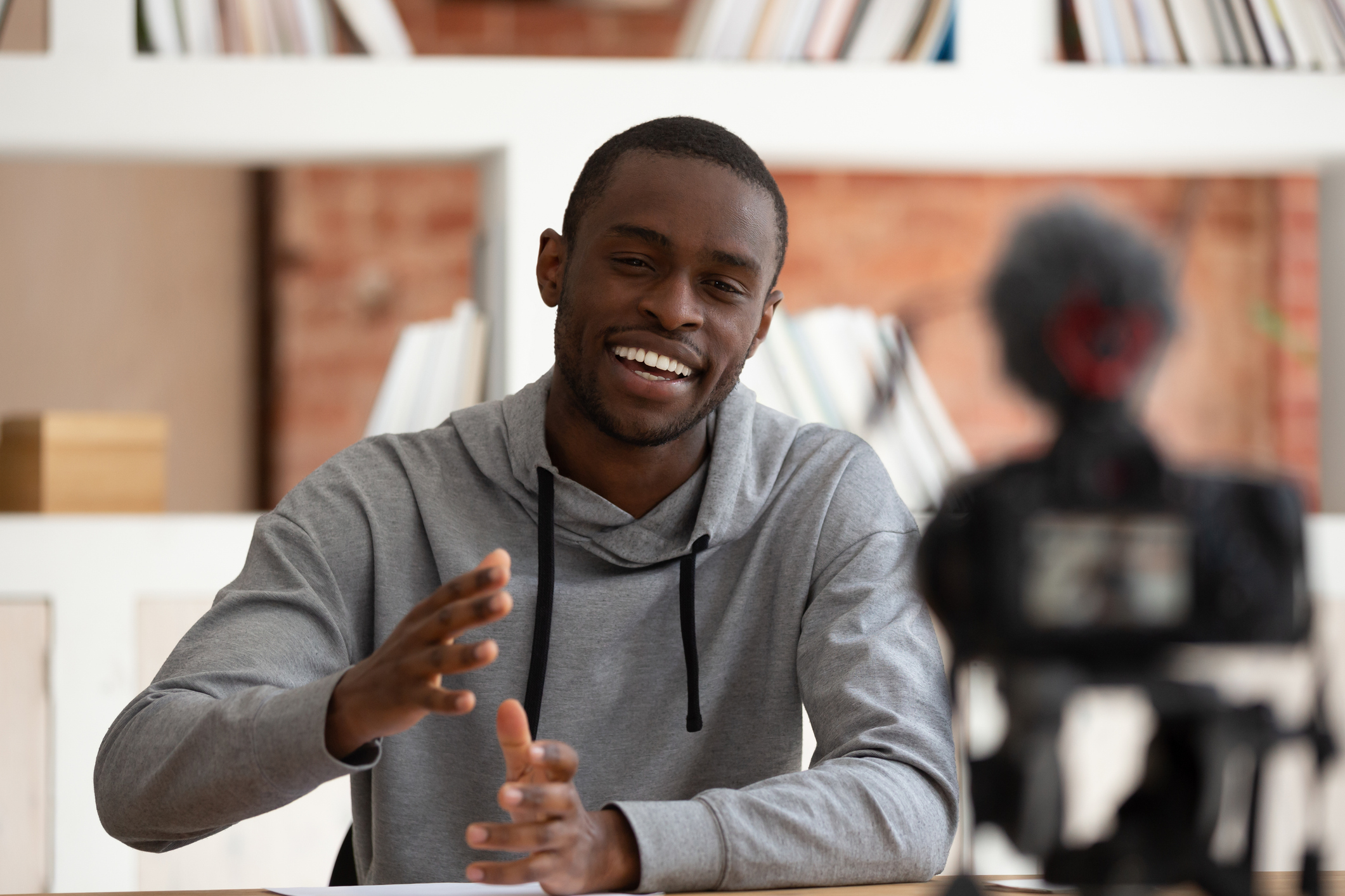 young black man in front of camera