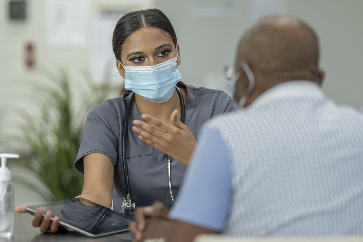 stock photo of nurse with older patient 